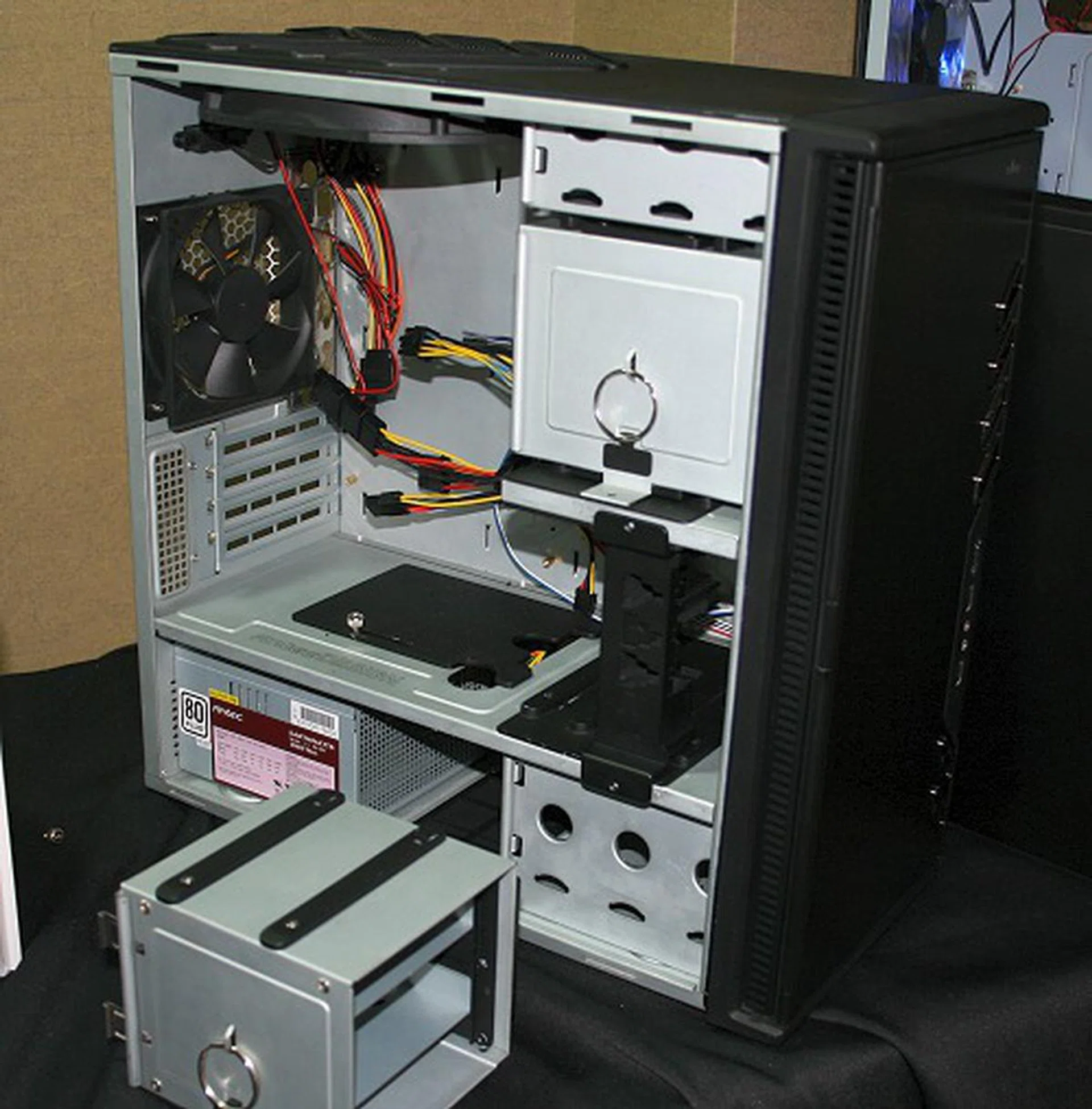  If you don't have many storage drives, you could remove one of the storage bay units and install an expansion slot card holder for lengthy graphics cards (such as the GeForce 8800 GTX / Ultra) among others.  
