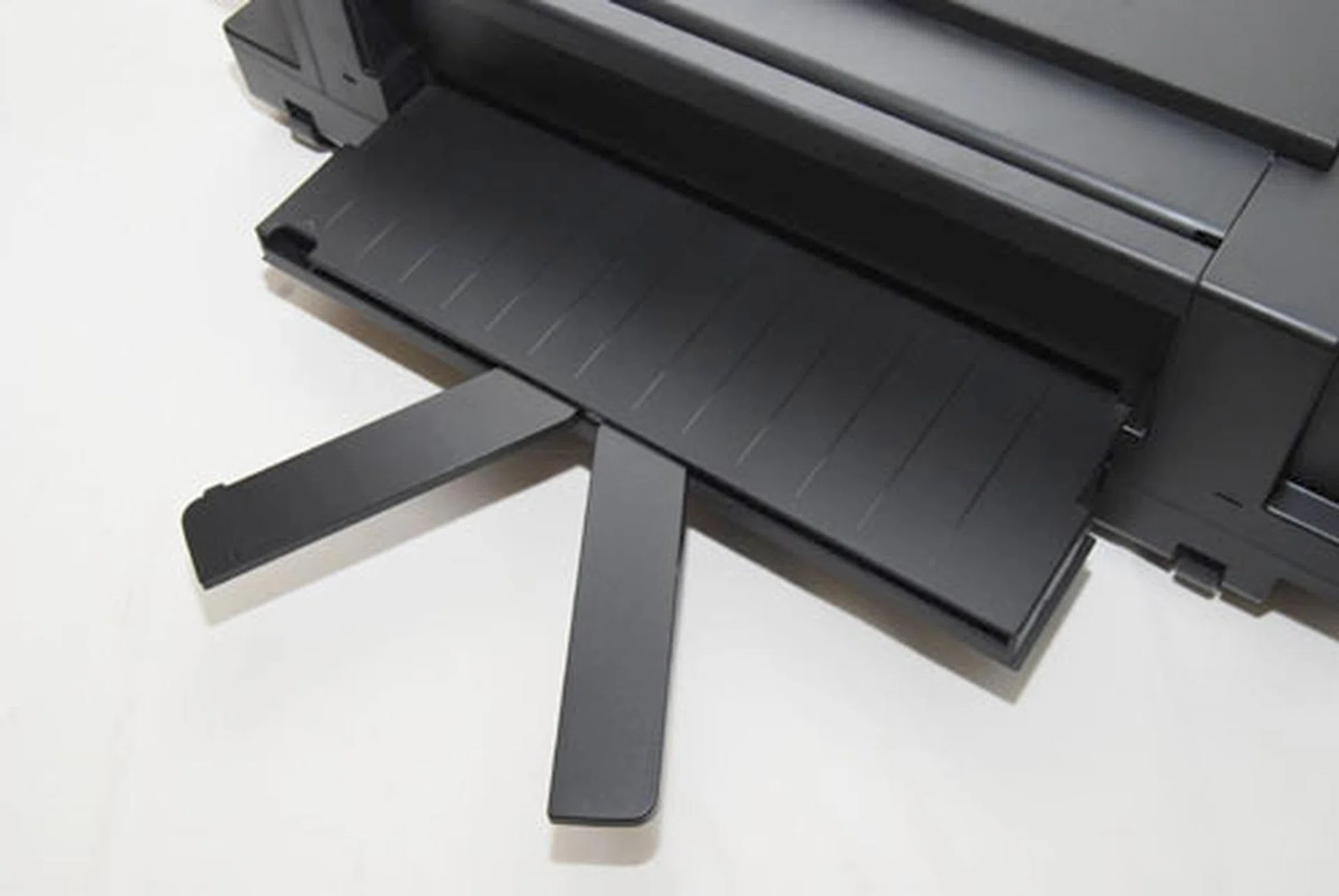 A pair of holders spring out to help hold the A3-sized paper in place. You'll have to factor in the extra space at the back whenever you want to print A3.