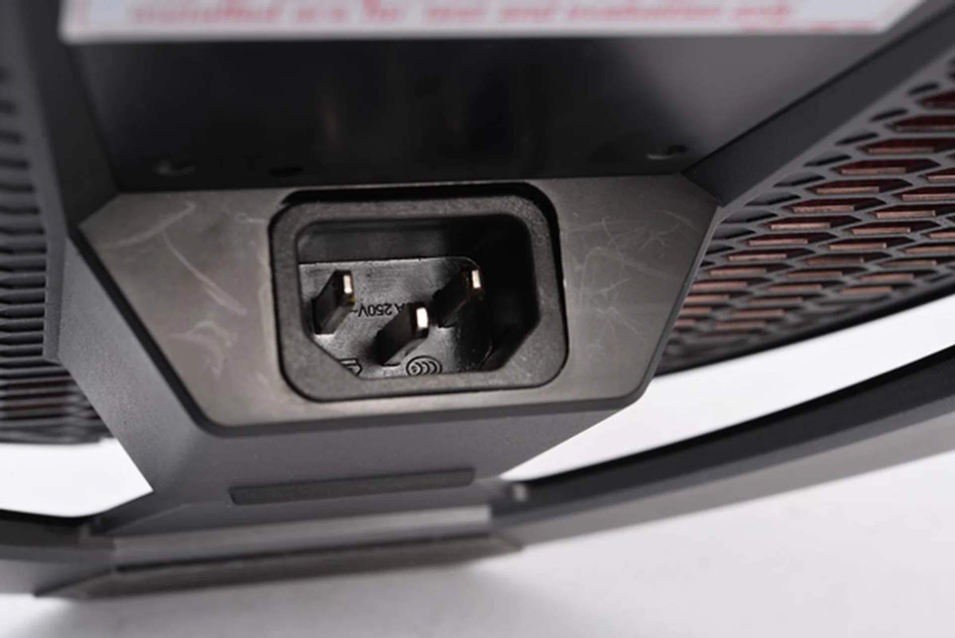 The power socket is located at the bottom, and so are the air intake vents.