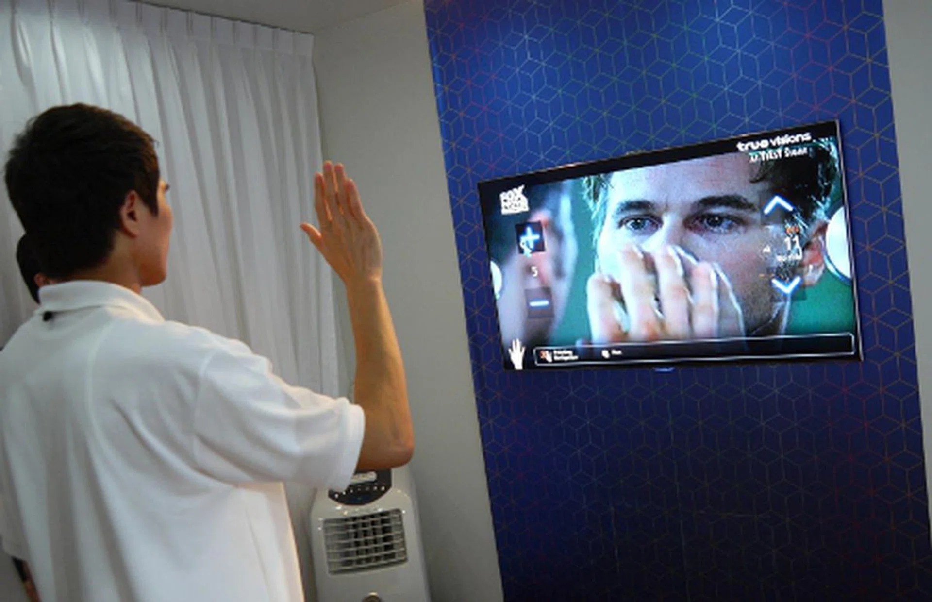A Samsung spokesman showed us how you may control the TV's channels or volume levels simply by moving your hands. To activate the onscreen function, clench your fist and the TV ought to register the command.