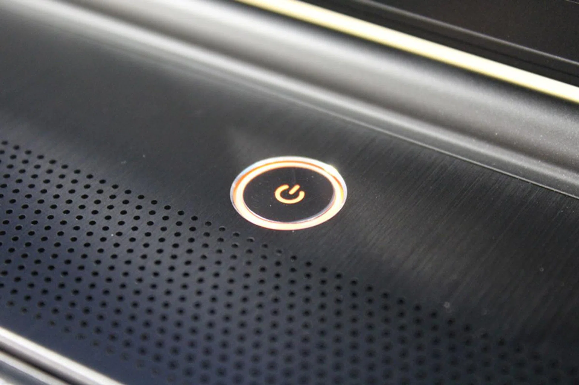The WS60 might be light on frills, but it still retains some influences from MSI's gaming notebook, like a power button that changes color.