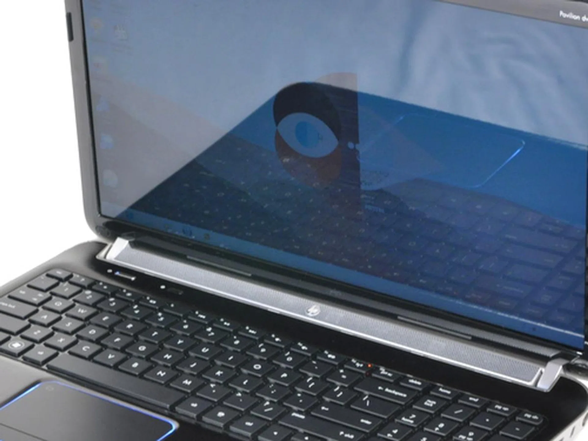 Glossy screens make the images on the screen look better, but they also act like mirrors reflecting anything that gives off more light than the screen does.