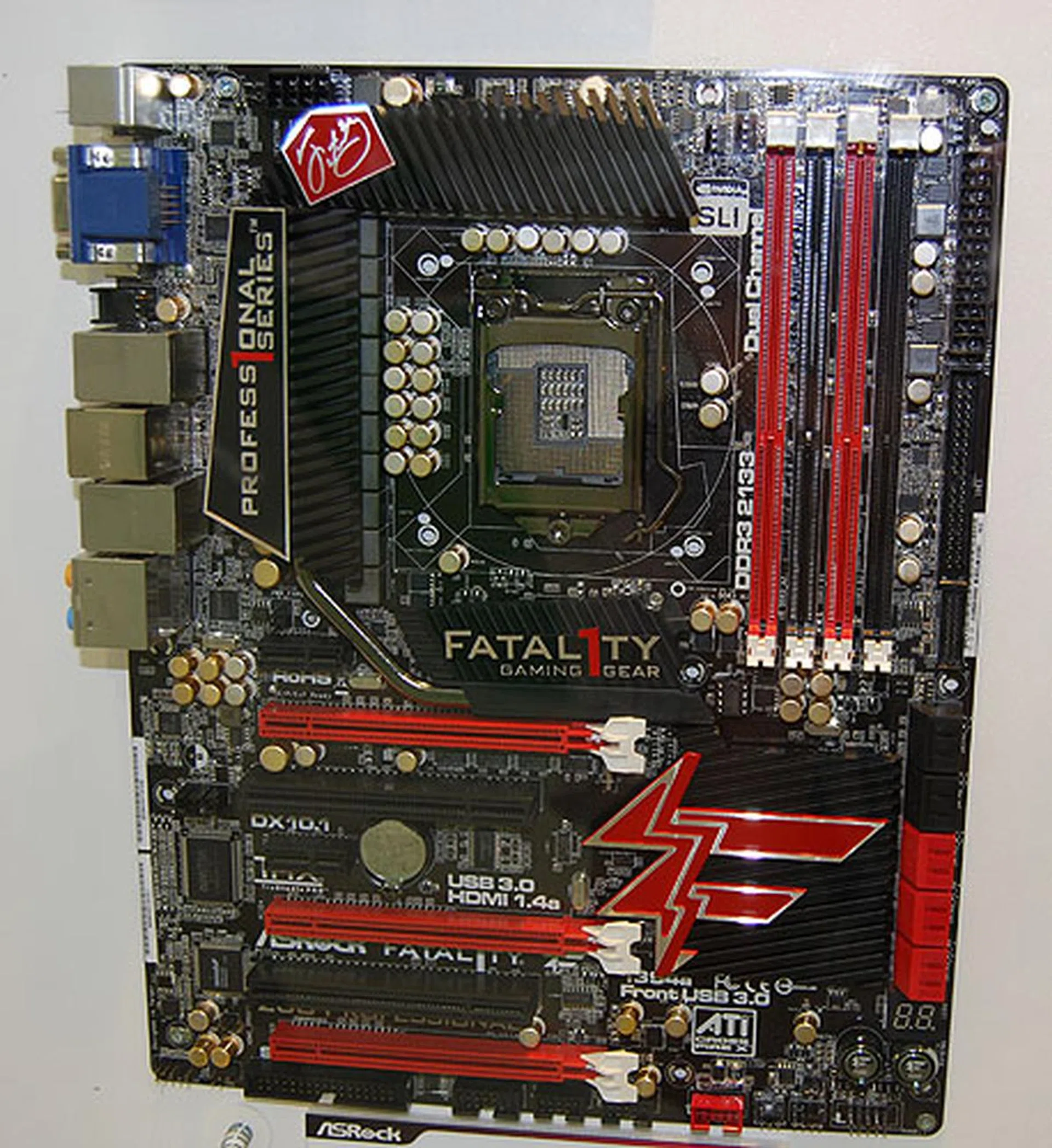 This is the Fatal1ty branded Z68 Professional. It comes with three PCIe 2.0 x16 slots with support for 3-way SLI/CrossFireX. It also has four display outputs, with two HDMI ports. 6 USB 3.0 ports are present, including one special Fala1ty mouse USB port.