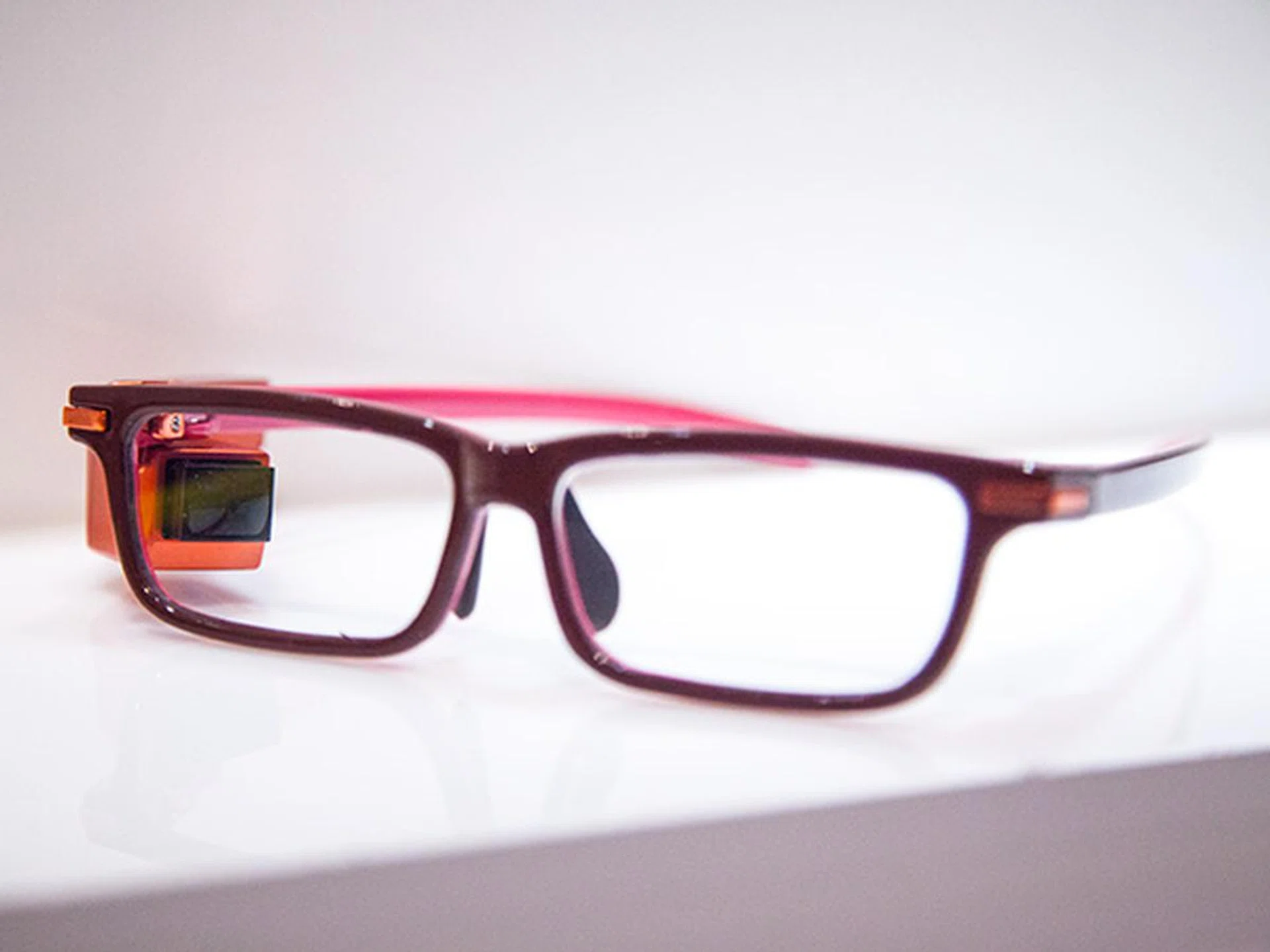 Toshiba Glass is the latest wearable device that uses a small and light projection module clipped to the side of the glass frame. Unlike Google Glass which projects information directly from the attachment, Toshiba's solution projects information onto the glass and subsequently reflected to the wearer's eye. The module is lightweight and detachable, but requires a wire attached to a computational unit and battery. There's no camera on the module.