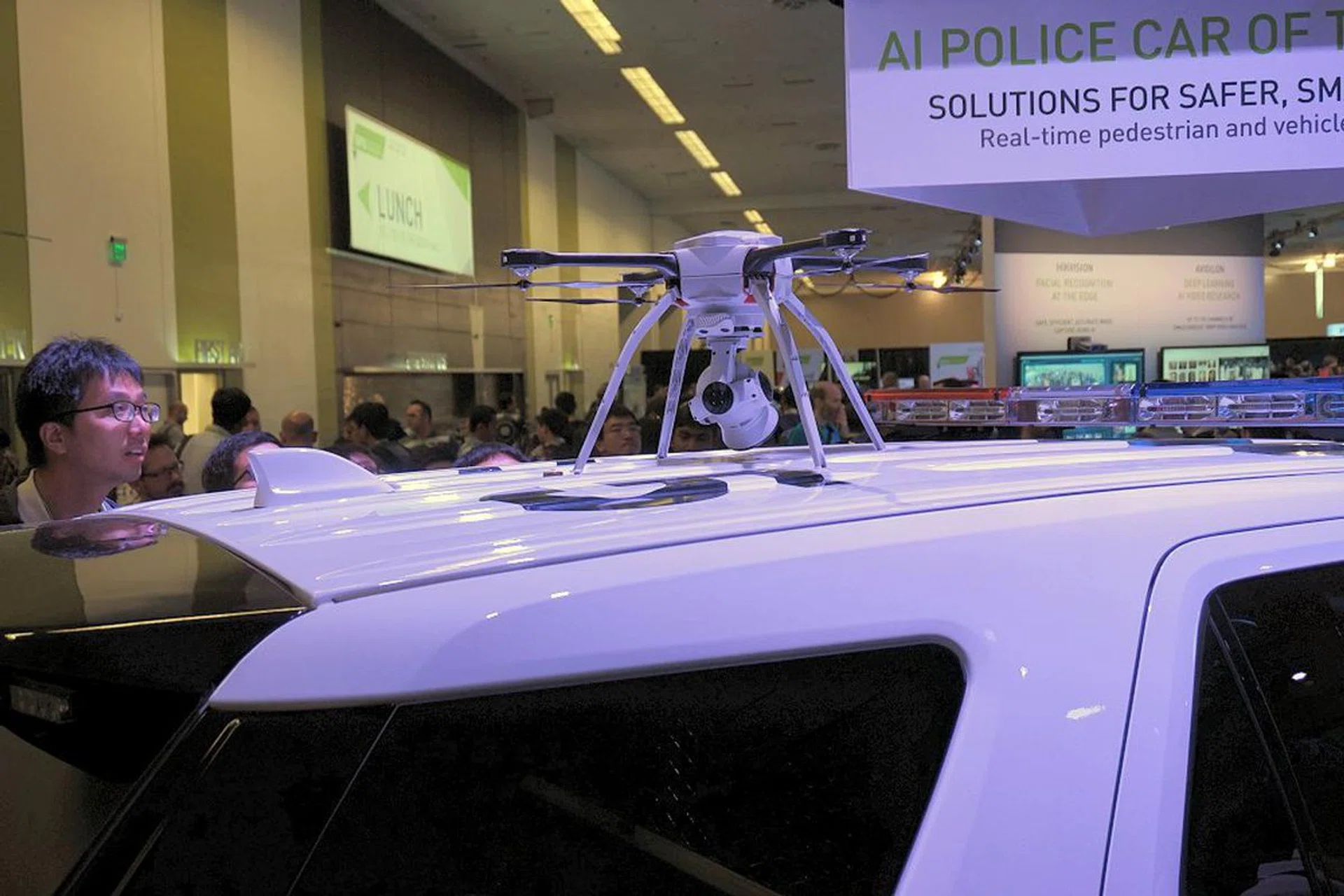 Mounted atop the AI police car, a drone that can be dispatched in a moment's notice for remote surveillance.