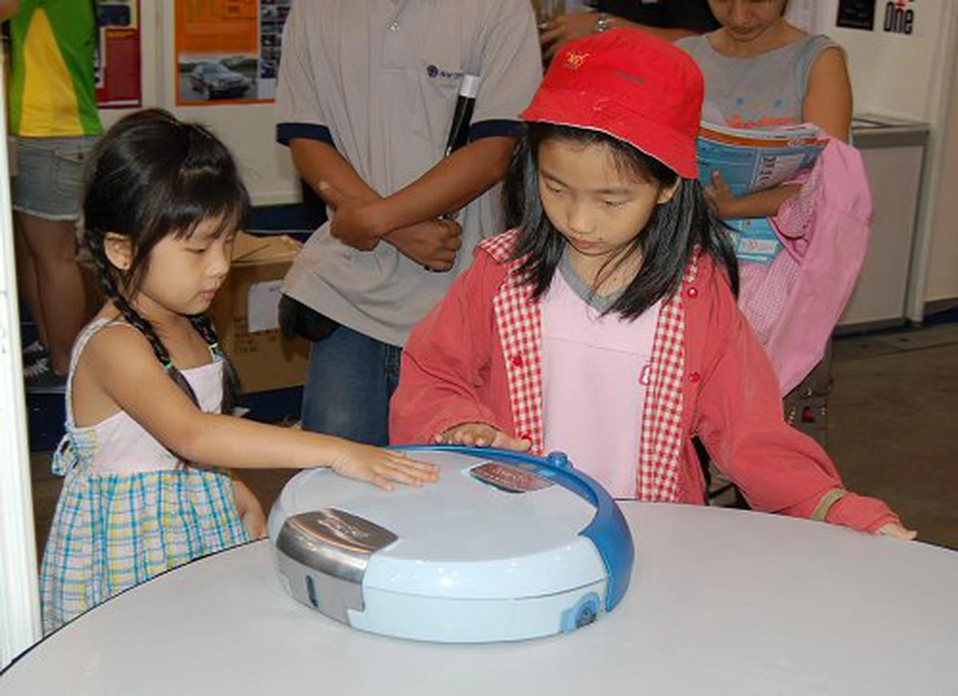 Fancy an autonomous vacuum cleaner that not only cleans your apartment but also keep your kids entertained? Perhaps the iRobot cleaner is the one you seek. Just look at how it's entertaining these younglings.