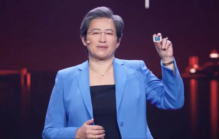 AMD CEO Dr. Lisa Su holding up a Ryzen 5000 series mobile processor.