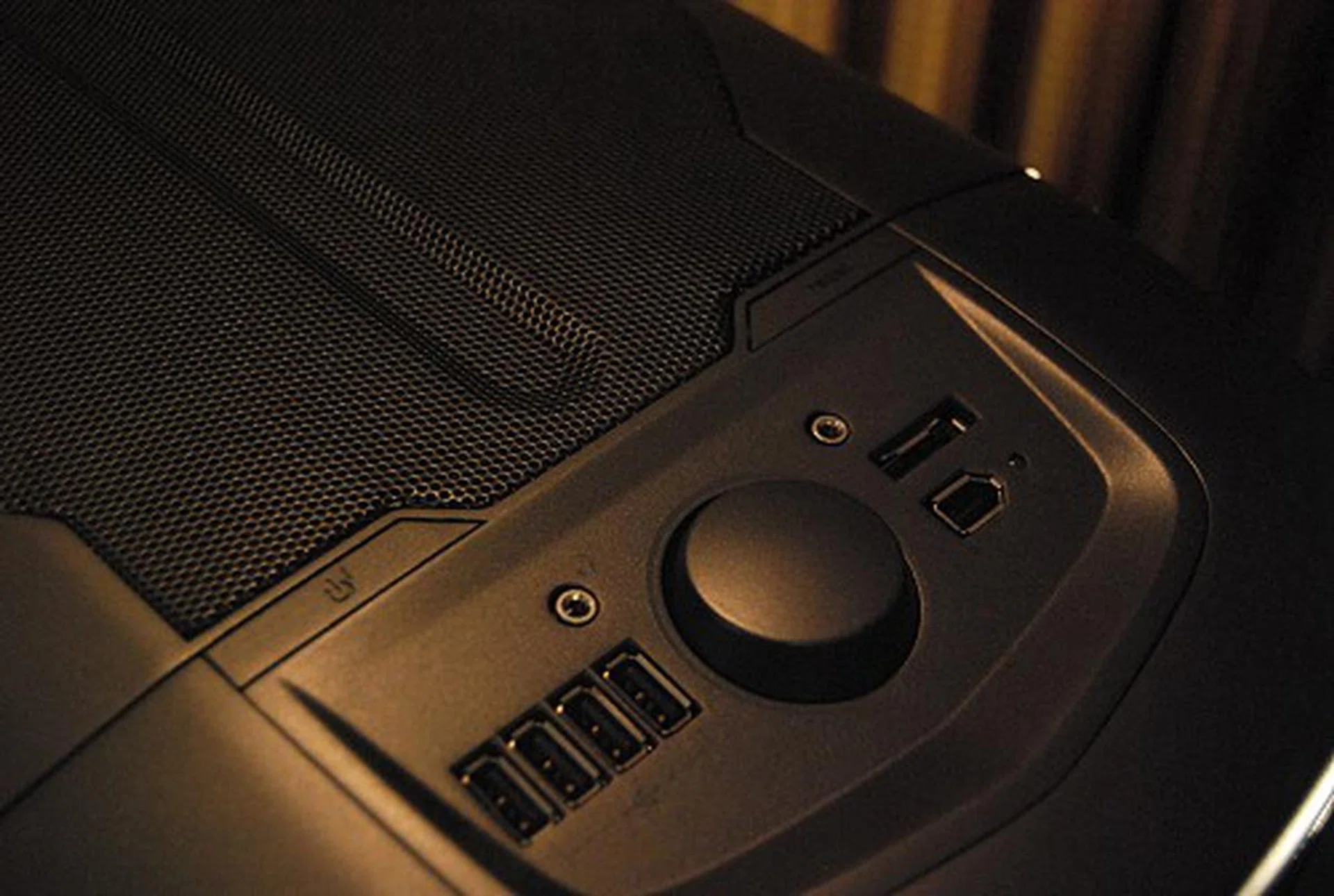 The top of the case here features an extensive array of front panel I/O ports, including a knob to control fan speeds.