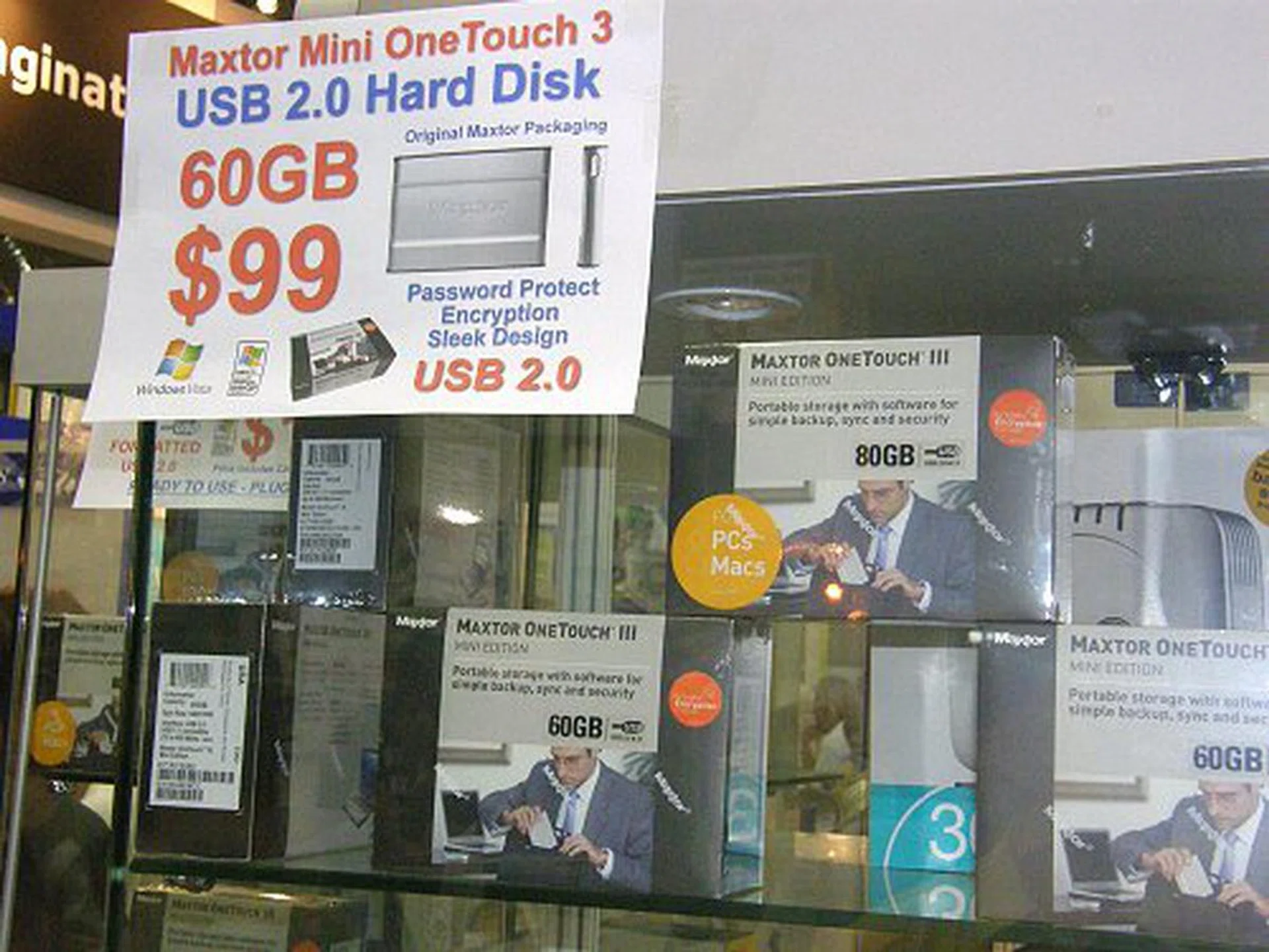  Besides Buffalo, Bizgram had a whole chuck load of Maxtor and Seagate portable HDD for sale. Here, the 60GB Maxtor Mini One Touch 3 USB 2.0 HDD with password protection and encryption features only costs S$99.  