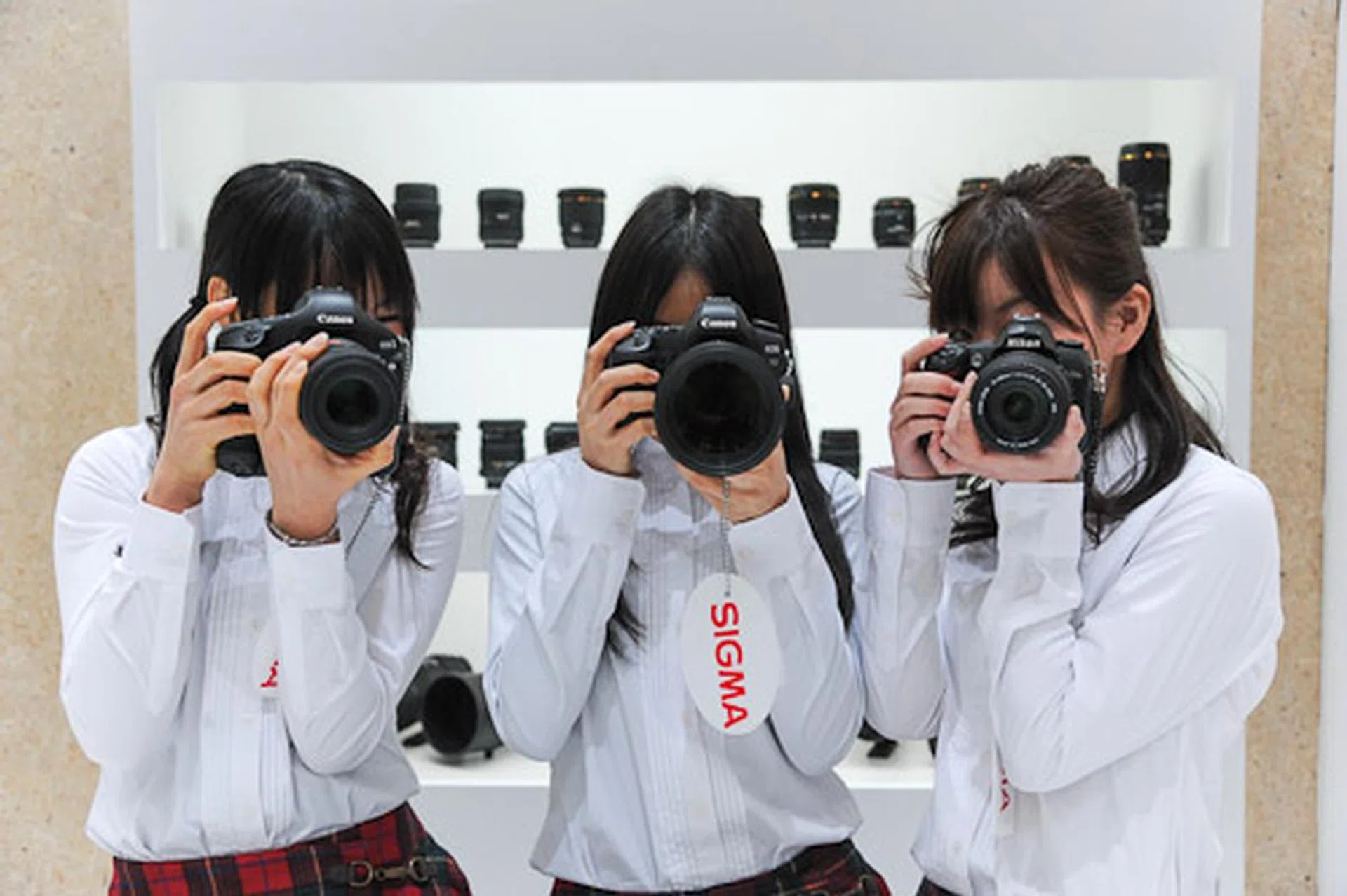 You could try any of Sigma's lenses at the booth, and the helpful booth girls would both help you with the lenses and help you test them by posing for you!