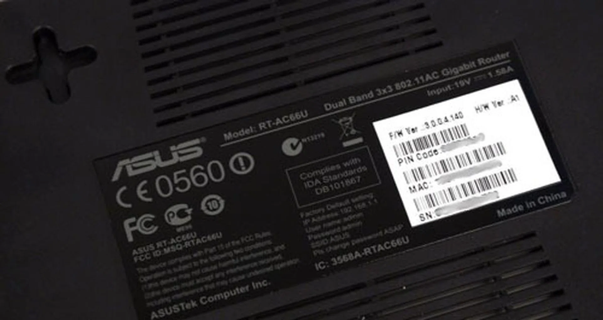 A label slapped beneath the router indicates its firmware version, PIN code, MAC address, and serial number. Ours was shipped with version 3.0.0.4.140.