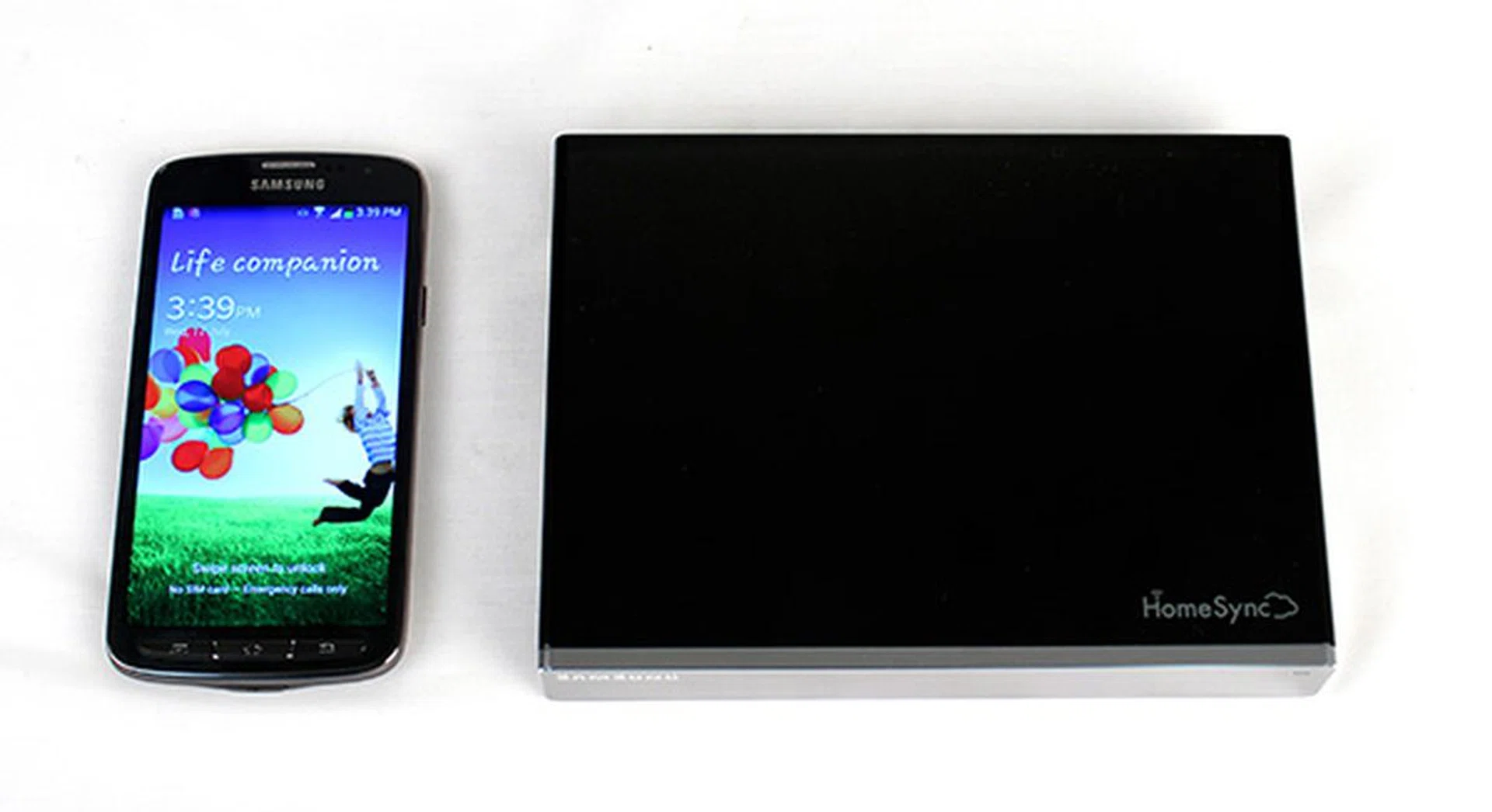The HomeSync device is actually really compact. Here it is next to the new Galaxy S4 Active.