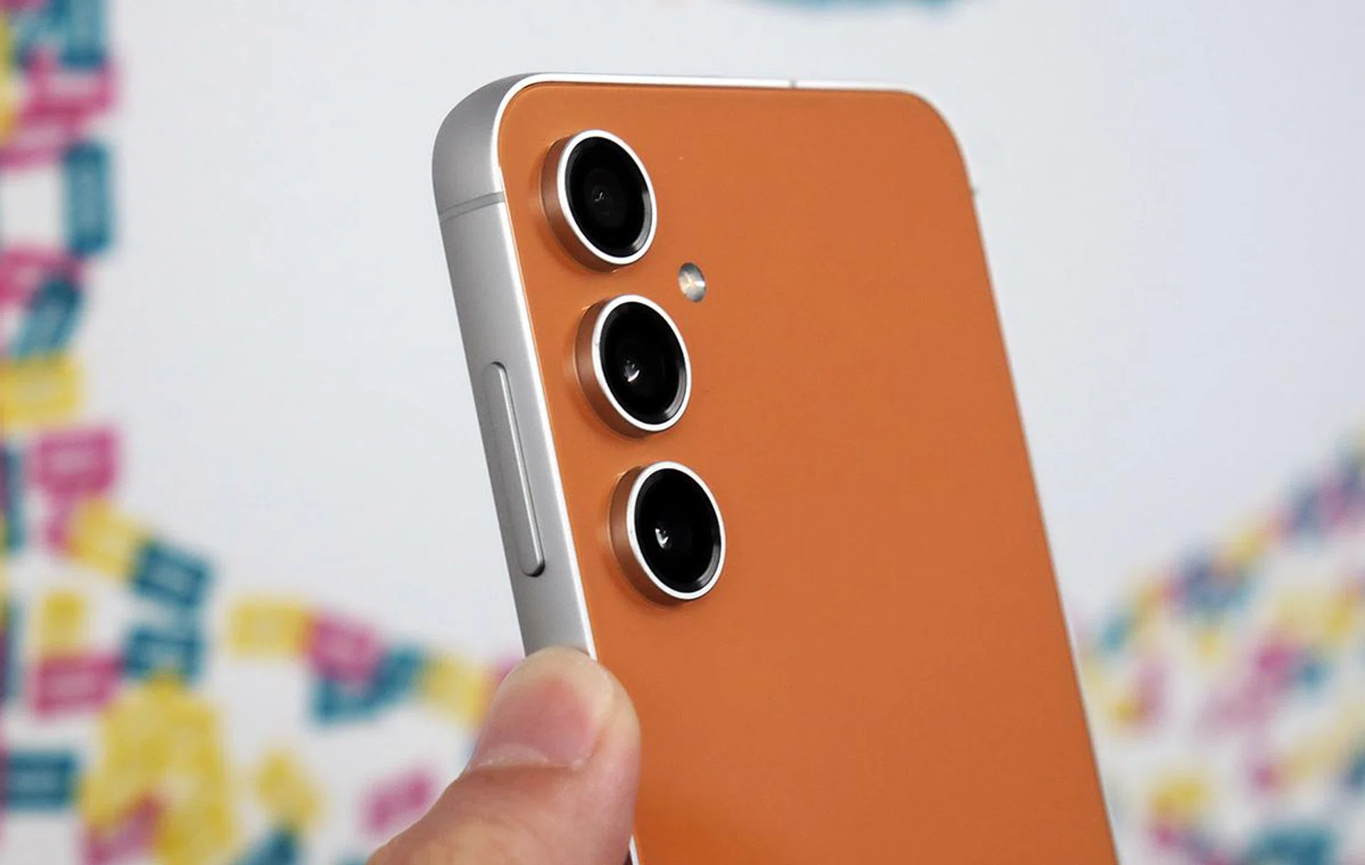 Samsung Galaxy S23 FE in Tangerine.