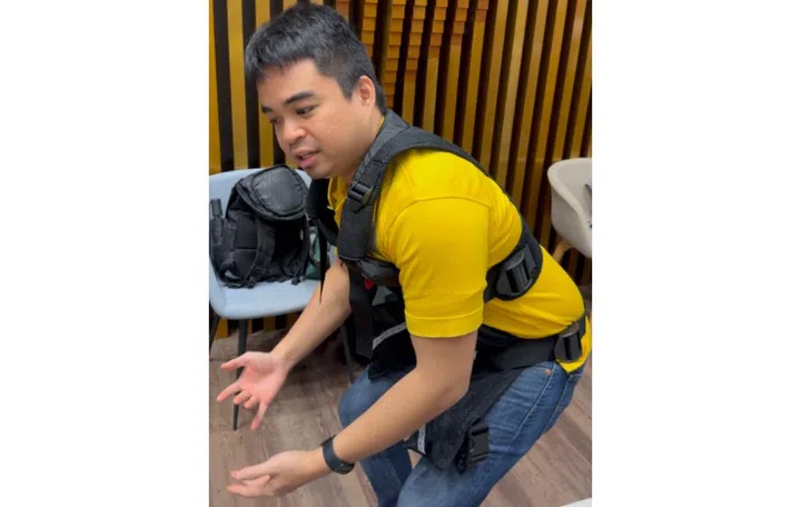 Rainier Natividad, co-founder of ArmasTec, demonstrating their AireLevate base suit. 