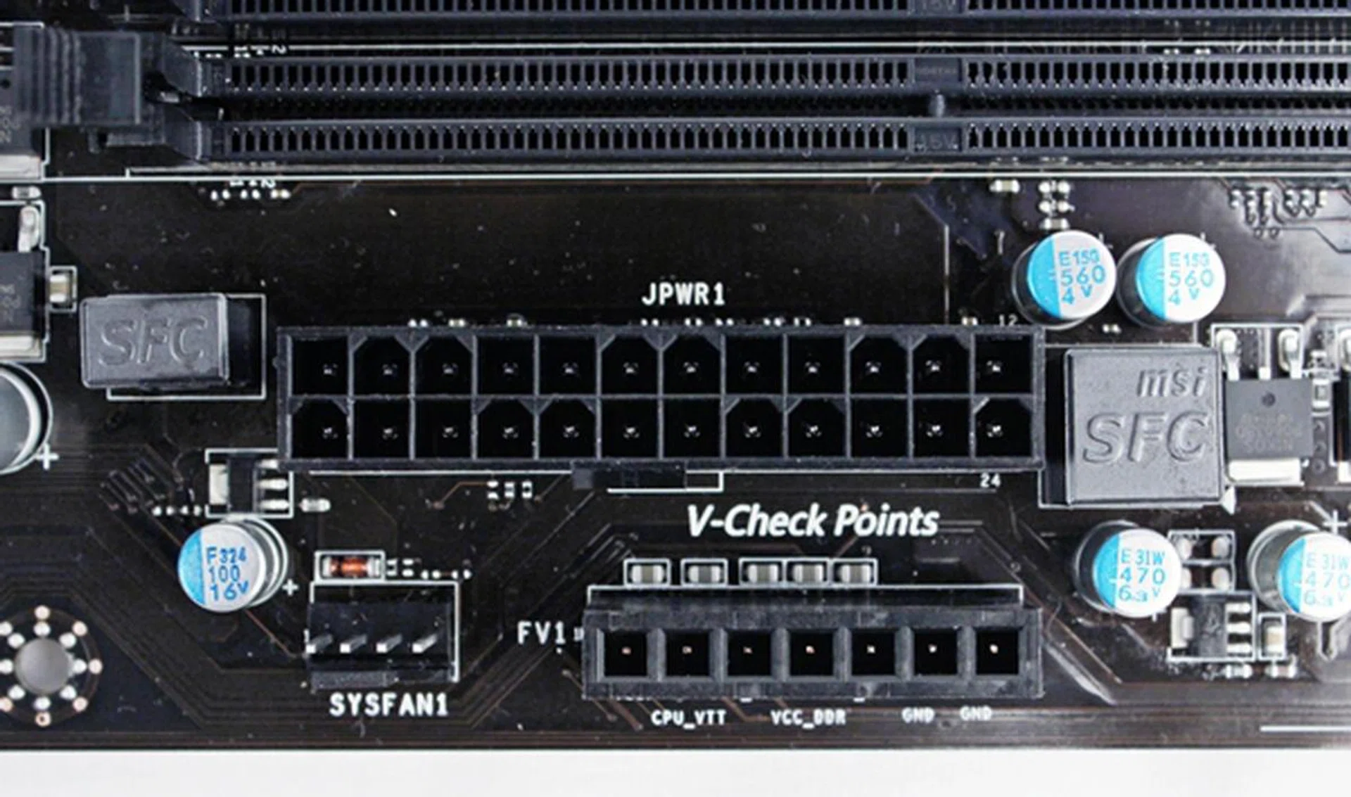Like the Big Bang Z77 MPower board, the voltage checkpoint connectors are positioned very close to the ATX power connector.