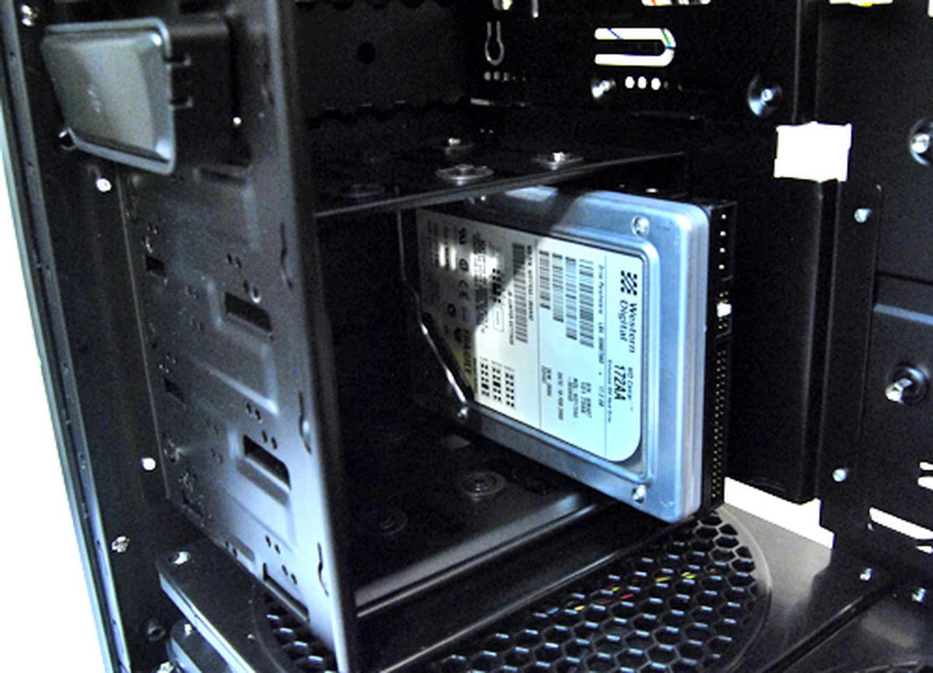 The drive cage goes beneath the 5.25-inch drive bays. If you are willing to sacrifice the drive cage, you can have up to eight 5.25-inch drives. Although it's hard to see why anyone would want to do that.