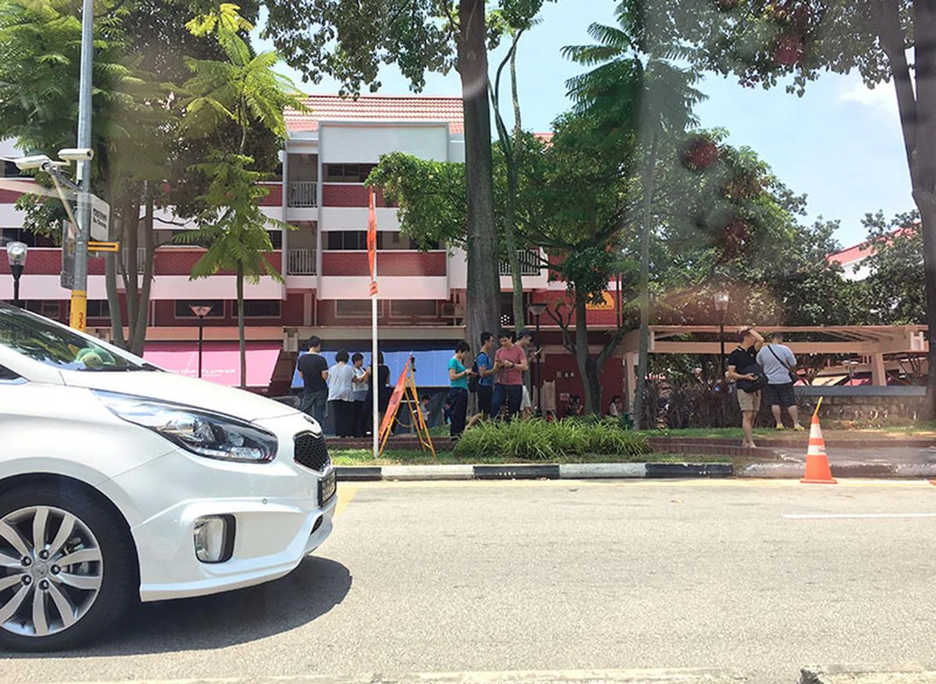 There were many trainers lining Changi Village road during lunch hour.