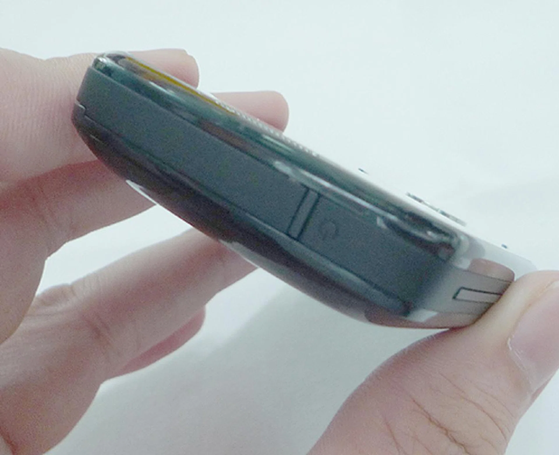 We thought the Power button was the big chunk to the right of the device as seen here. But turns out, it is that thin vertical strip instead.