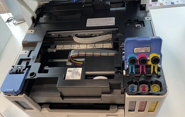 The ink tanks have unique tops so you can't fill them with the wrong colour. 