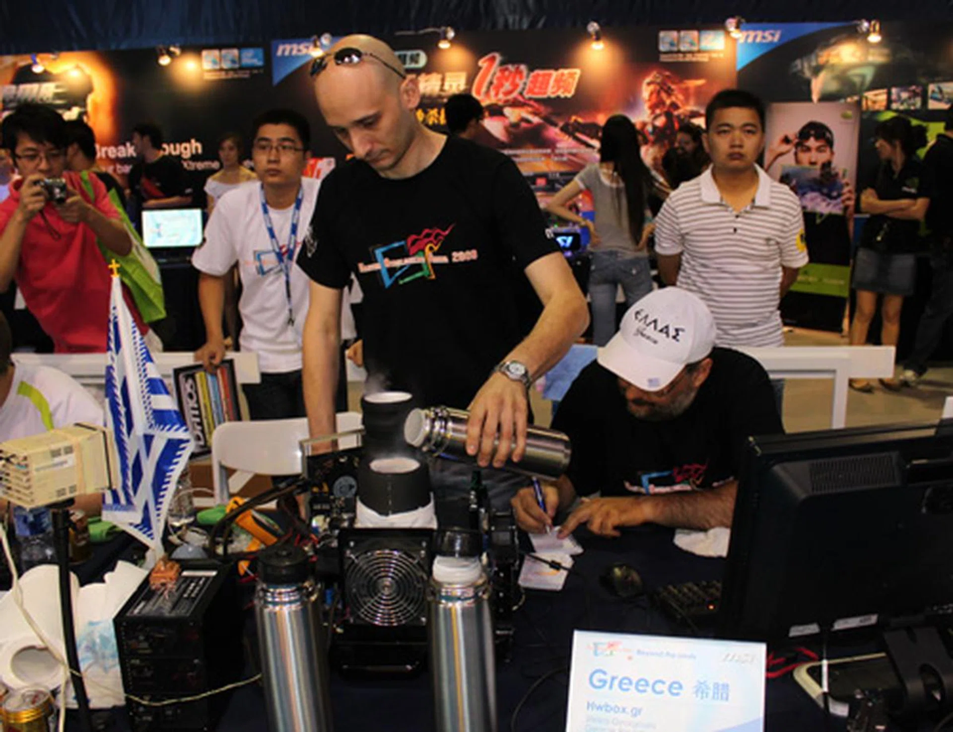 The Greeks have made themselves elaborate custom coolers and here they are feeding more liquid nitrogen into the system.