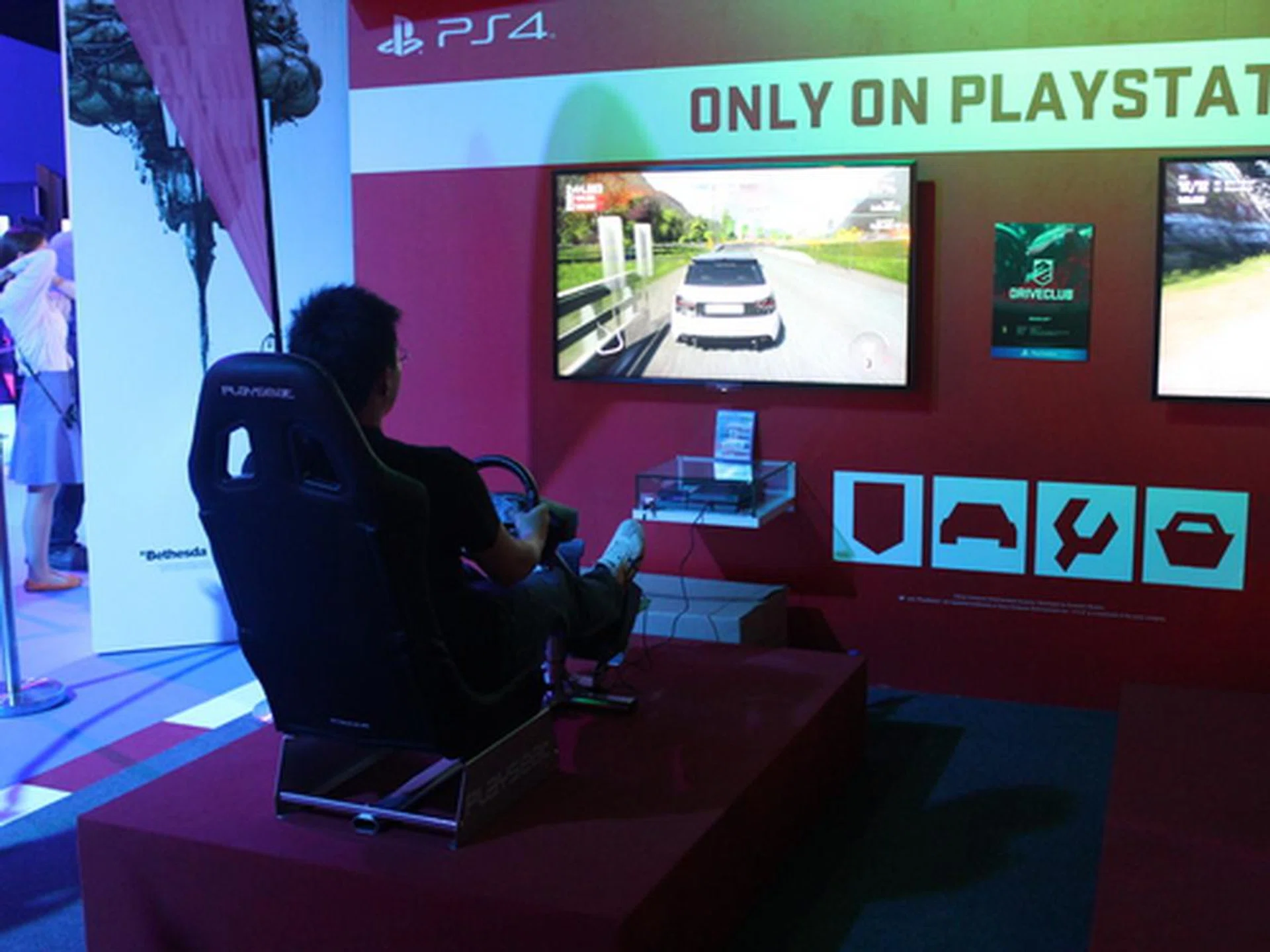 Sony had Driveclub running on two custom driving rigs.