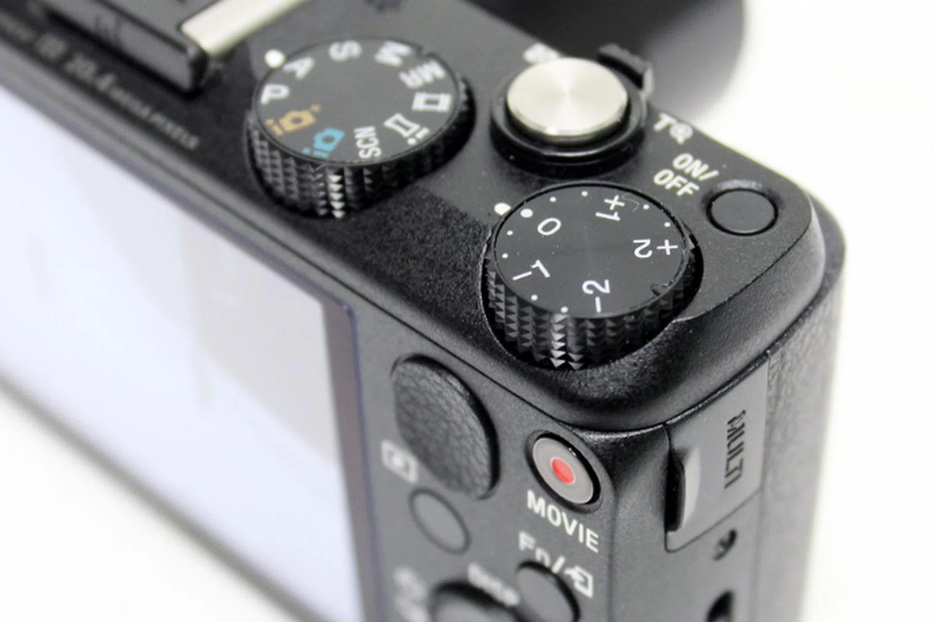 The HX60V comes with a dedicated exposure compensation dial. Just don't forget to set it back to 'zero' when you're done. 