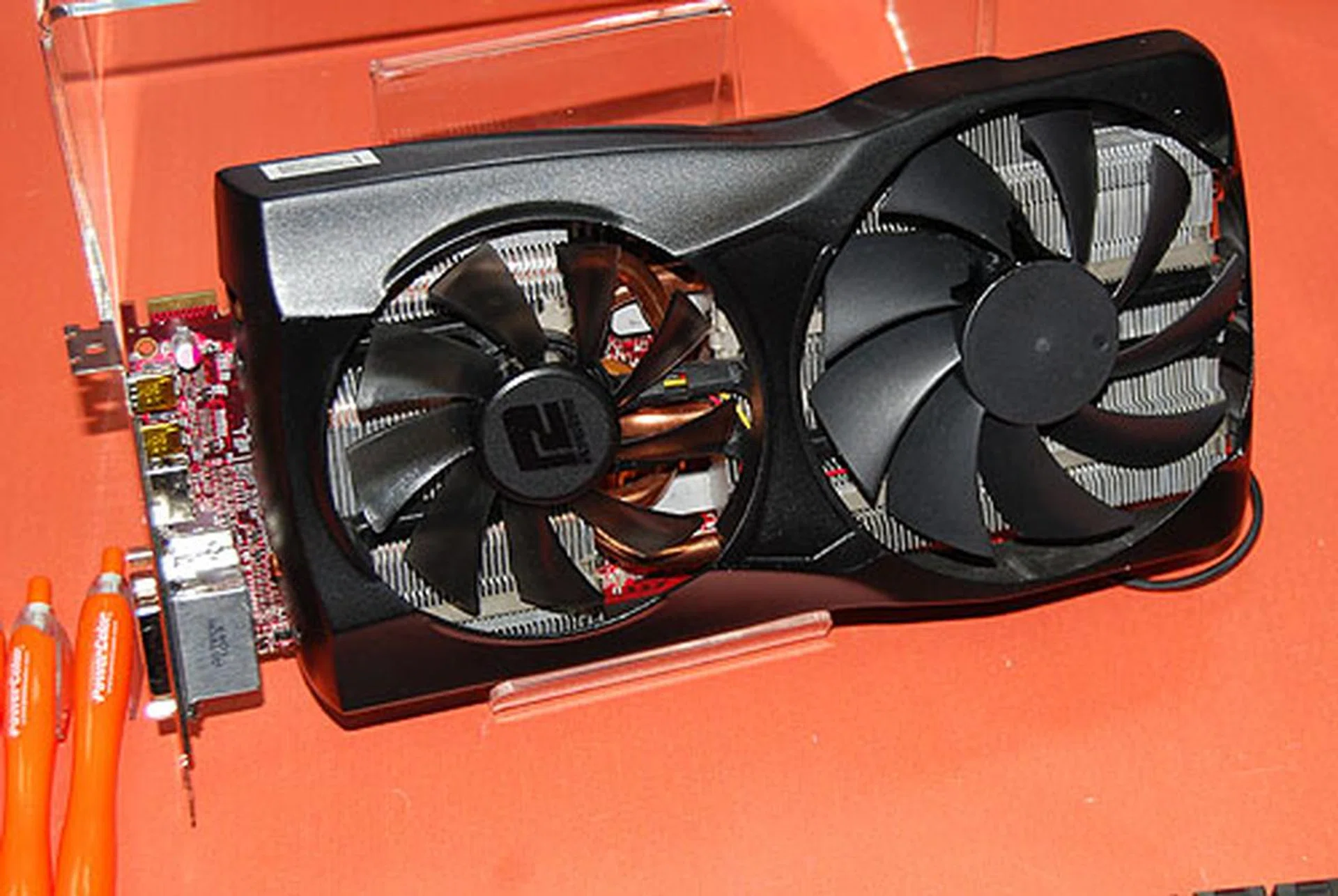This huge, custom Radeon HD 6970 X2 is another unique design from PowerColor. Notice the different cooler fan sizes? PowerColor claims that the differences help to drive the air towards the rear of the chassis, leading to improved airflow. 