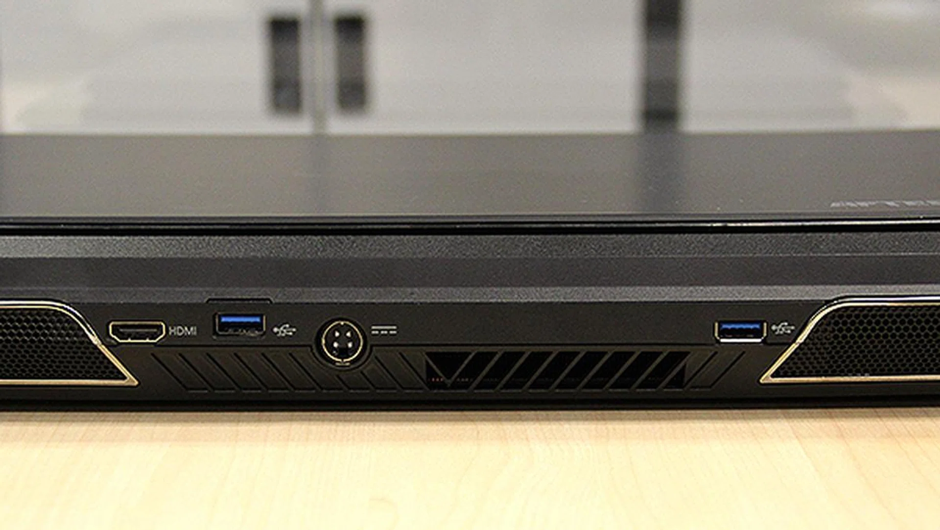 Towards the rear, in between the two exhaust vents are two more USB 3.0 ports, a HDMI port and the DC-in jack.