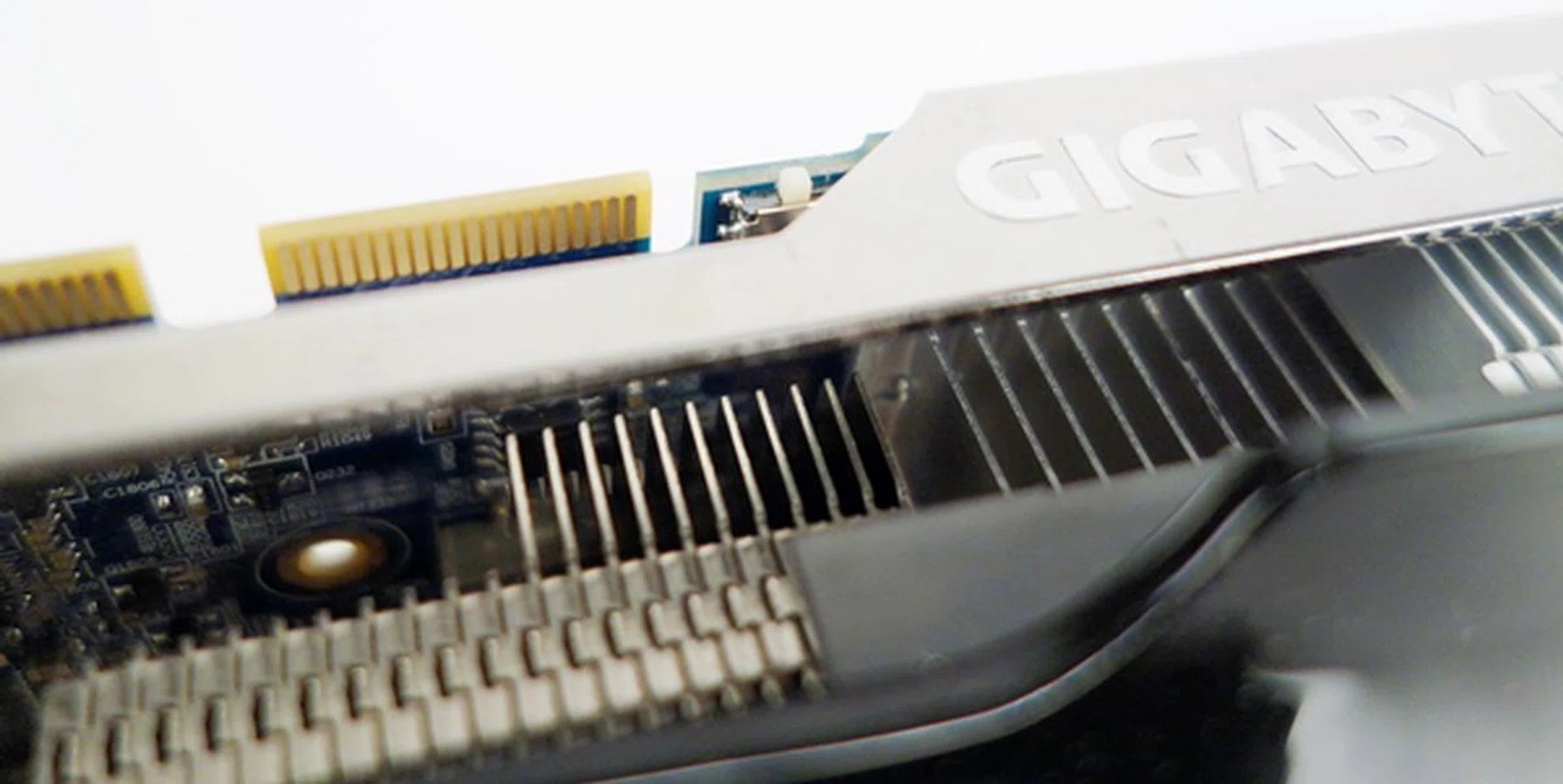 The DIP switch for toggling between BIOSes is located near the one of the CrossFire connectors, and the switch is almost hidden by the metal bracket.