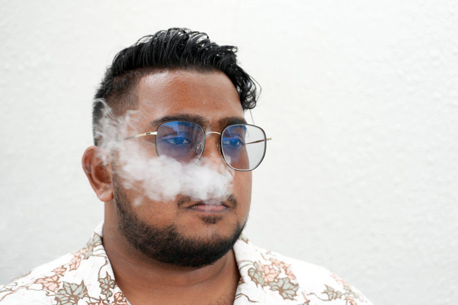 The A7R was able to render skin tones accurately. 70mm at f/4.0, 1/250s, ISO 400. Disclaimer: This is not an endorsement for smoking, but to prove how it handles foreground and background elements while preserving the skin tone with finesse.