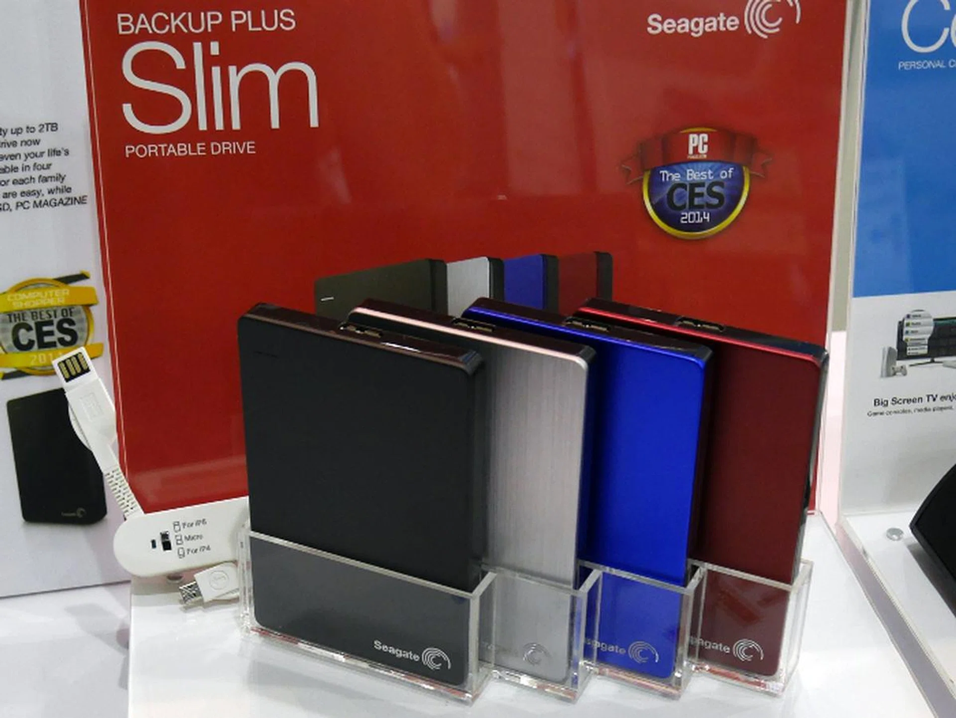 The Seagate Backup Slim Plus is your basic portable hard disk drive that comes in four colors. The 1TB model costs $85 and comes with a free pouch, while the 2TB model costs $159 and comes with a free pouch as well as a multi charger worth $29.  