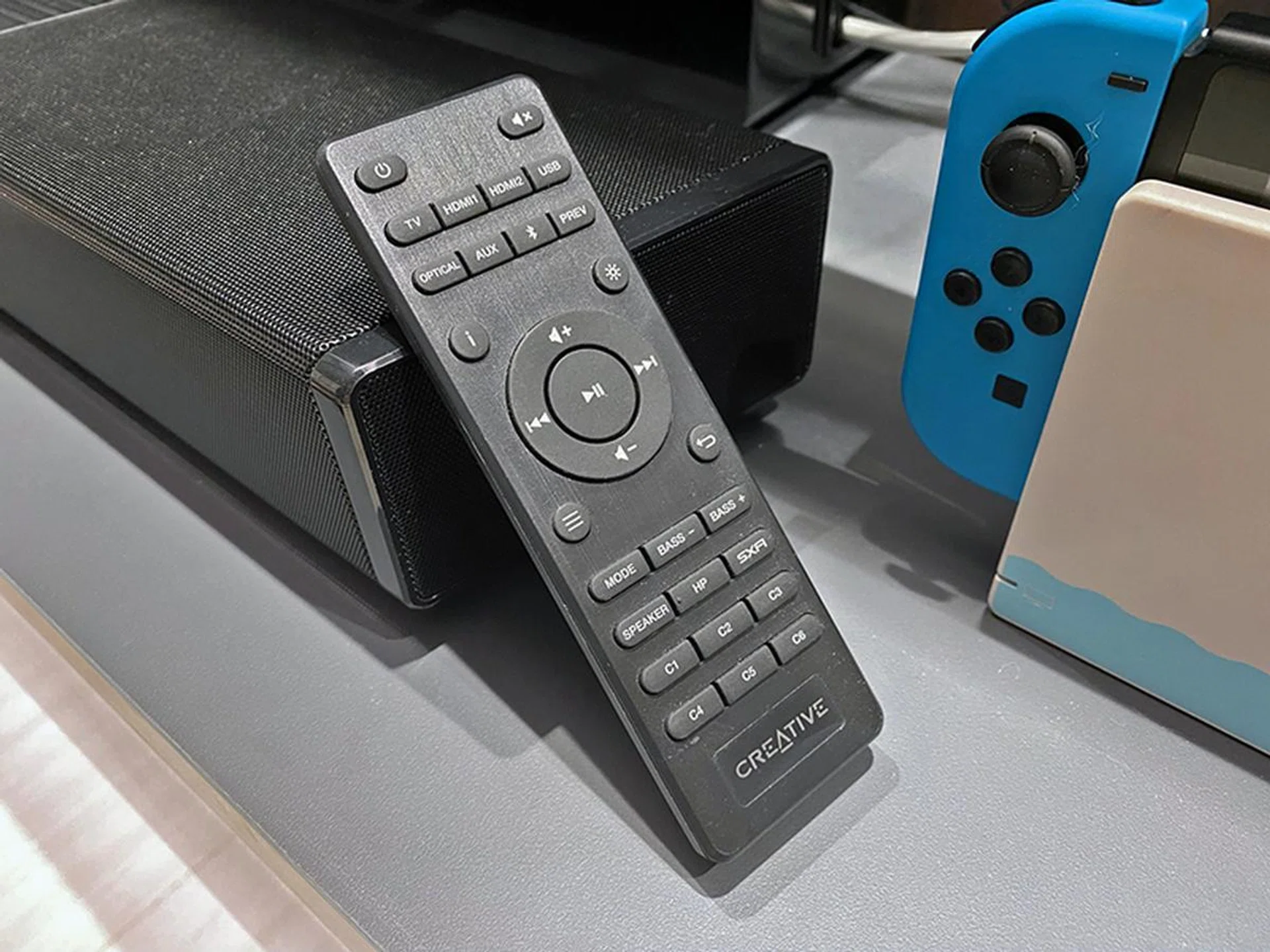 Don't be fooled by the faux-brushed metal look -- this remote feels cheap and has a high latency. You're probably better served by the soundbar's companion app on your phone for better control.