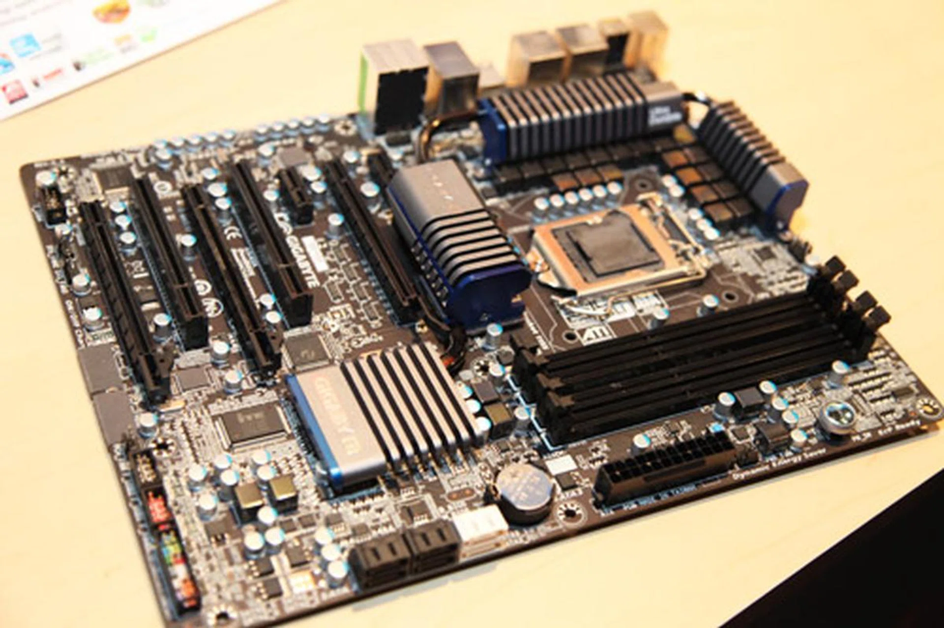 The new Gigabyte GA-P67A-UD5 is the latest motherboard built for the new Sandy Bridge microprocessor. It's also Gigabyte's first foray into black PCB design. The GA-P67A-UD5 comes with a 20 phase power VRM design, SATA 3.0 storage, USB 3.0, two PCIe 2.0 graphics slot for SLI and CrossFireX and their proprietary 3X USB power delivery system.