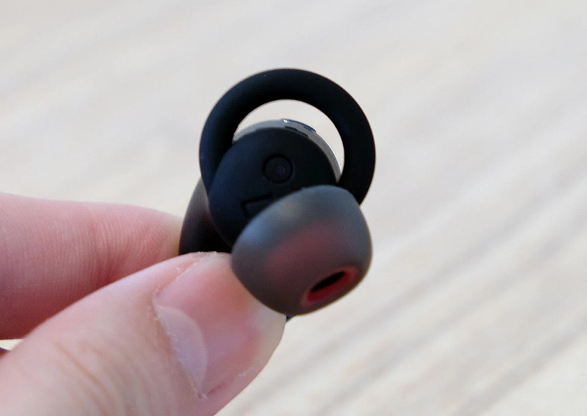 The odd-looking thing is called an O-hook and it's supposed to help ensure a more secure fit.