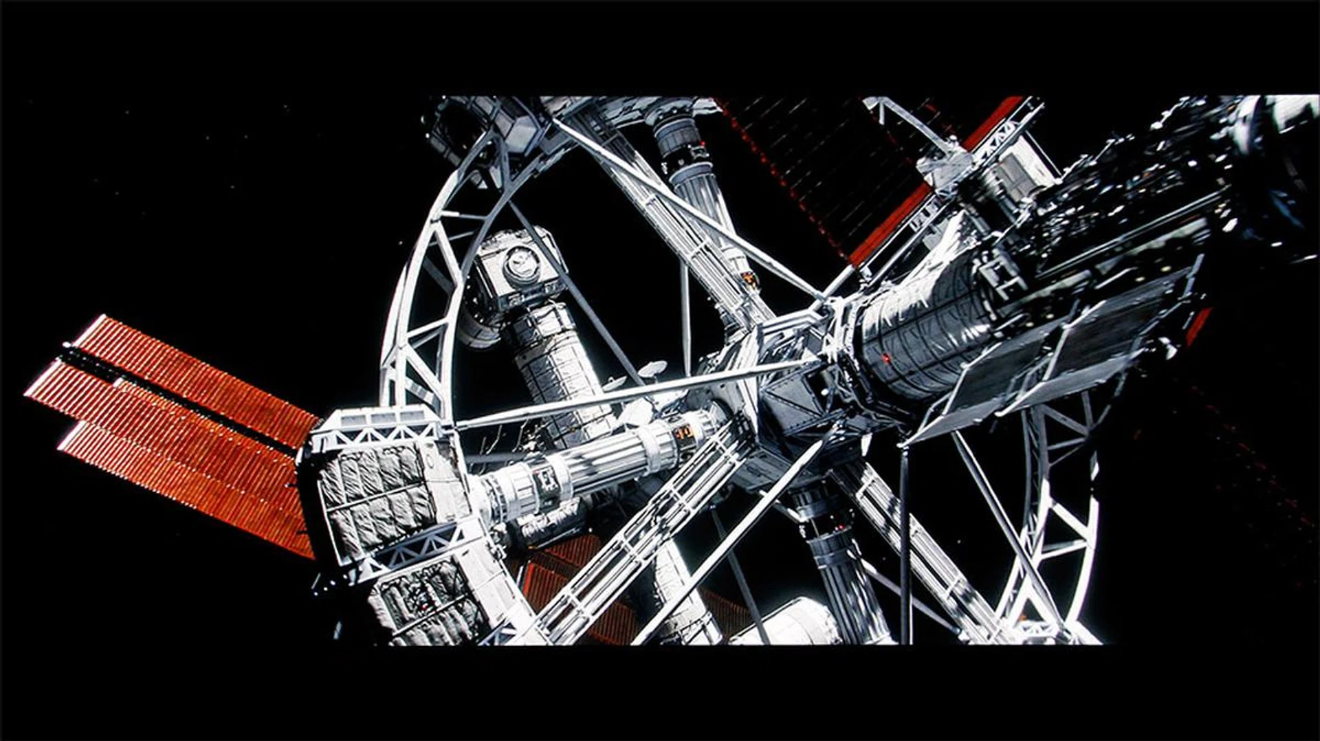 Look at the how the top and bottom black bars melt into the vast emptiness of deep space, look at the area around the stars, look at those deep, deep, deep blacks. (Scene from The Martian.)