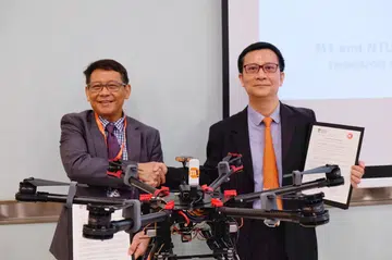 NTU ATMRI Director Prof Vu Duong and M1 CTO Denis Seek at the MOU signing