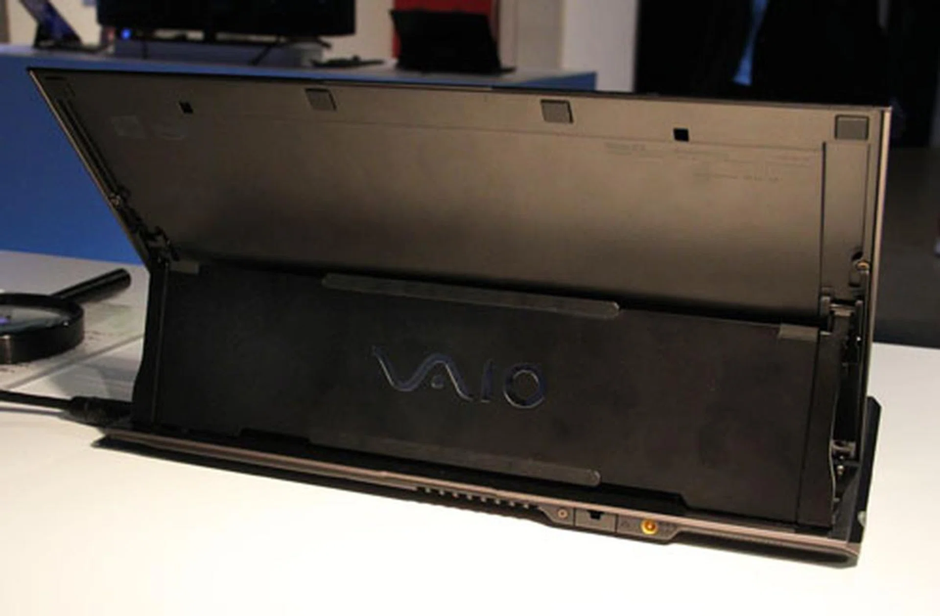 From behind you can see the panel that slides out to hold the screen upright.