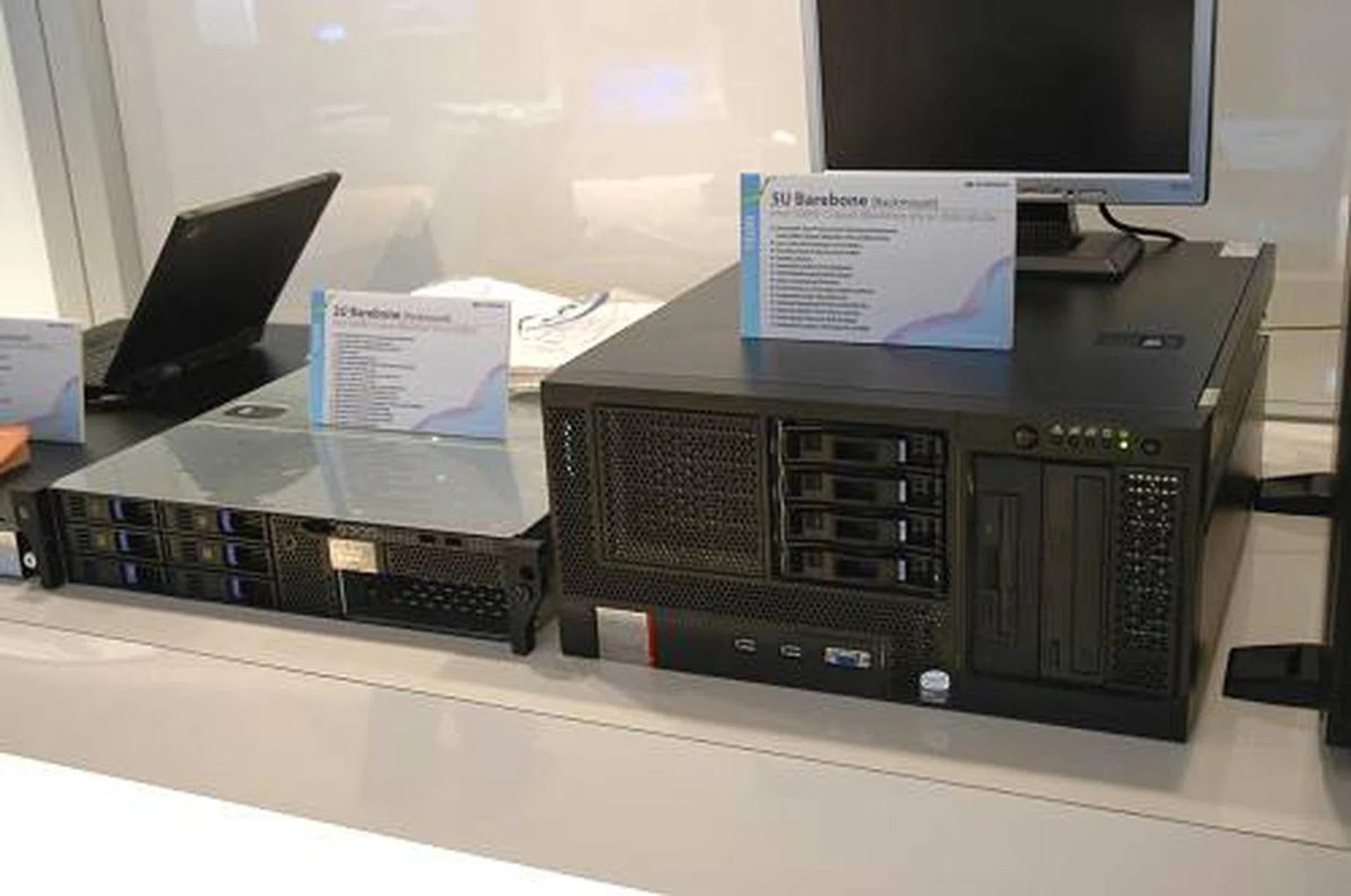 ECS 1U and 5U rackmount barebone designs on display, both featuring Blackford platforms for the latest Woodcrest Xeons.