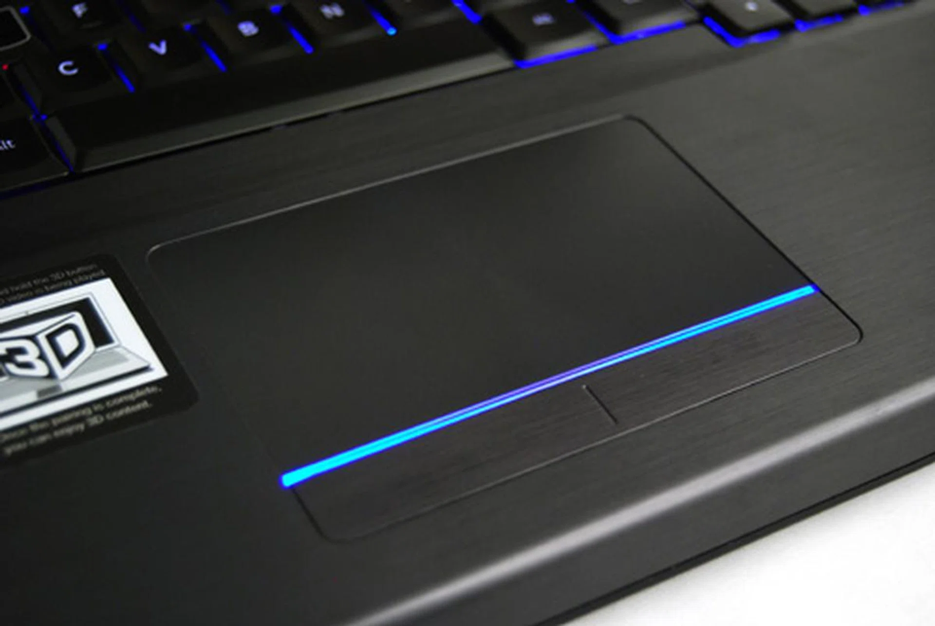 The trackpad is smooth and responsive and features the same smoke-brushed aluminum look.