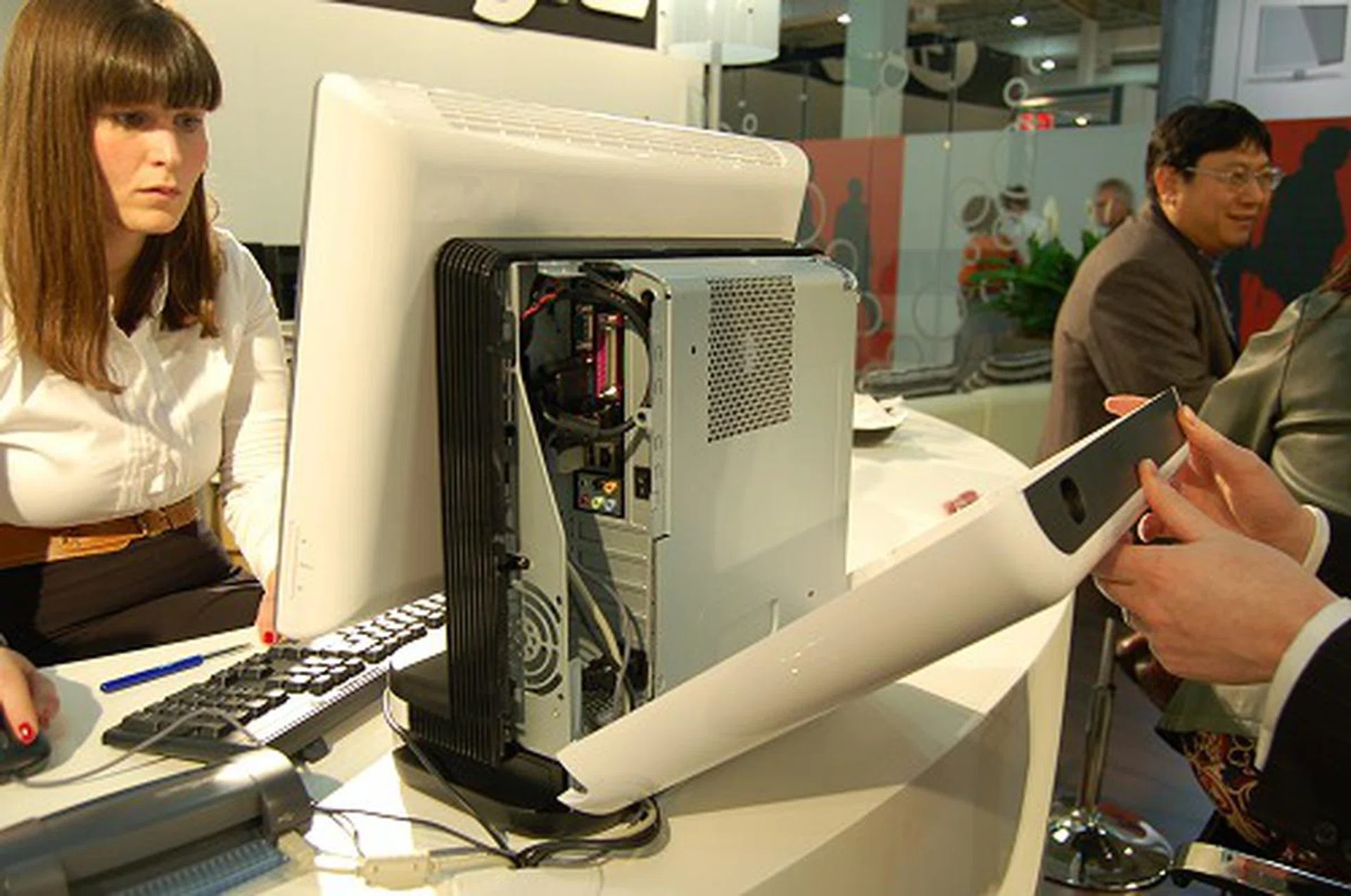  Just unlatch the rear to access the internals which is yet again hidden by another metal shield. The plastic exterior hides all the unsightly cables away. Inside, the system can take in any microATX motherboard and you can configure it as you please (it accepts up to four low-profile expansion cards). The system itself comes with the LCD screen, a 300W PSU (which is also a standard easily replaceable model) and a card reader. So basically, you buy the pretty shell and fill it in with your goodies.  