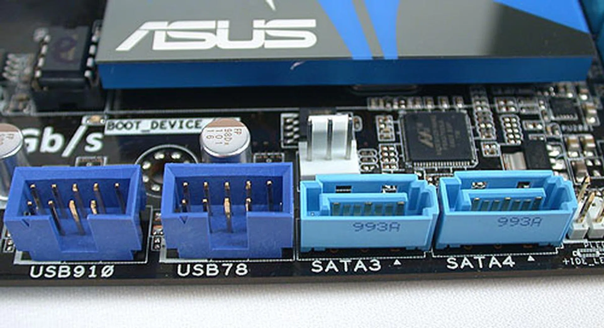 The remaining two SATA 3.0Gbps ports provided by the P55 chipset have been moved here, beside the USB headers. 