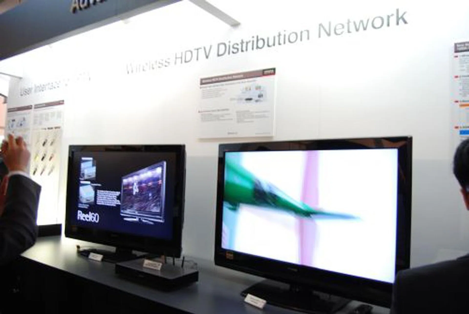  Hitachi demonstrated a wireless HDTV distribution display between two of its Reel60 HDTVs (up to three units stream from one single source is possible) based on the 802.11n wireless network with MIMO protocol. Using a sliced-based technique applies more error-correction towards high priority components in the MPEG stream while the picture quality is said to improve by up to 3dB signal-to-noise ratio.  