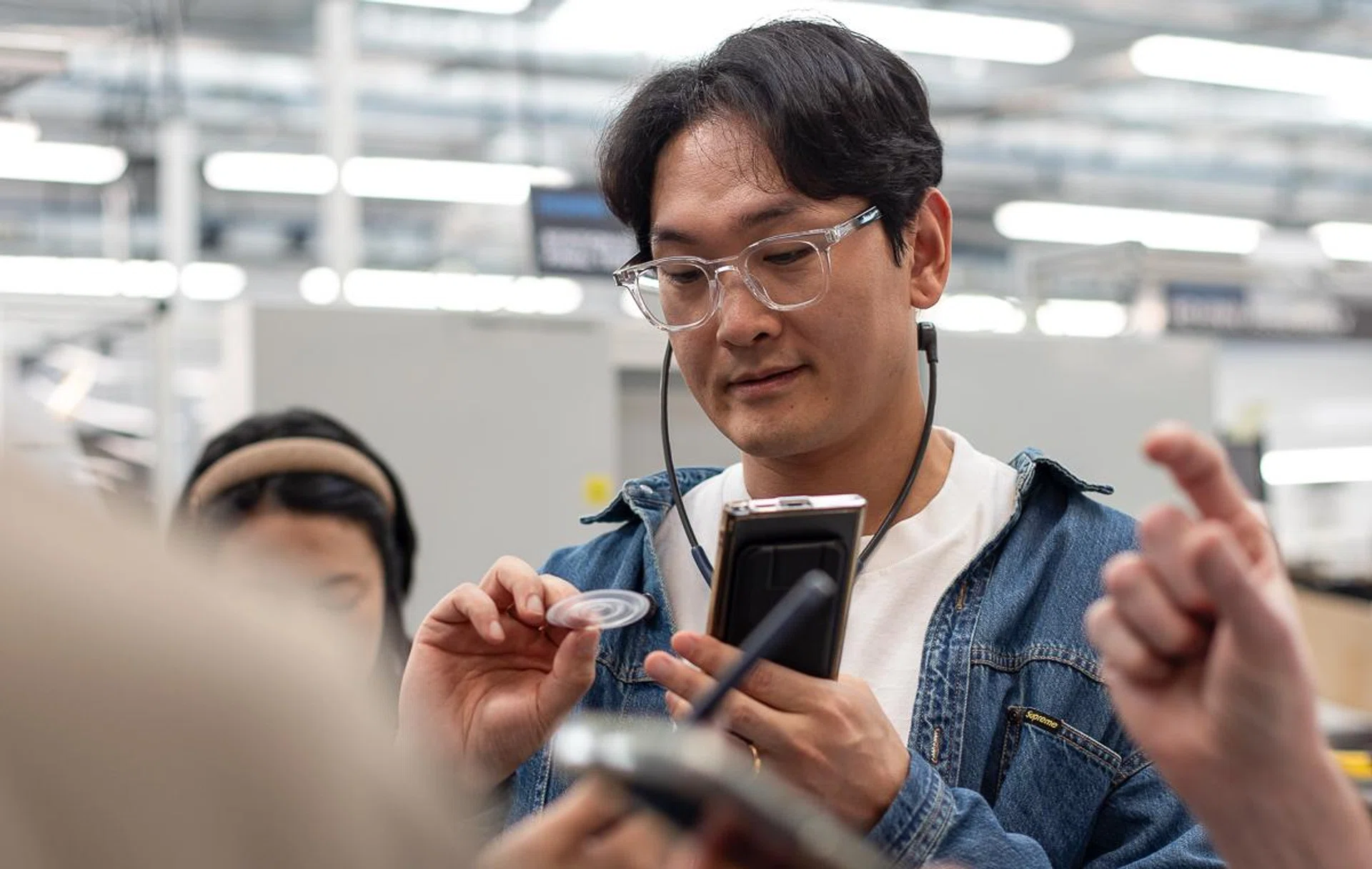 Holding a foil that has been stamped into shape. Photo: Sennheiser