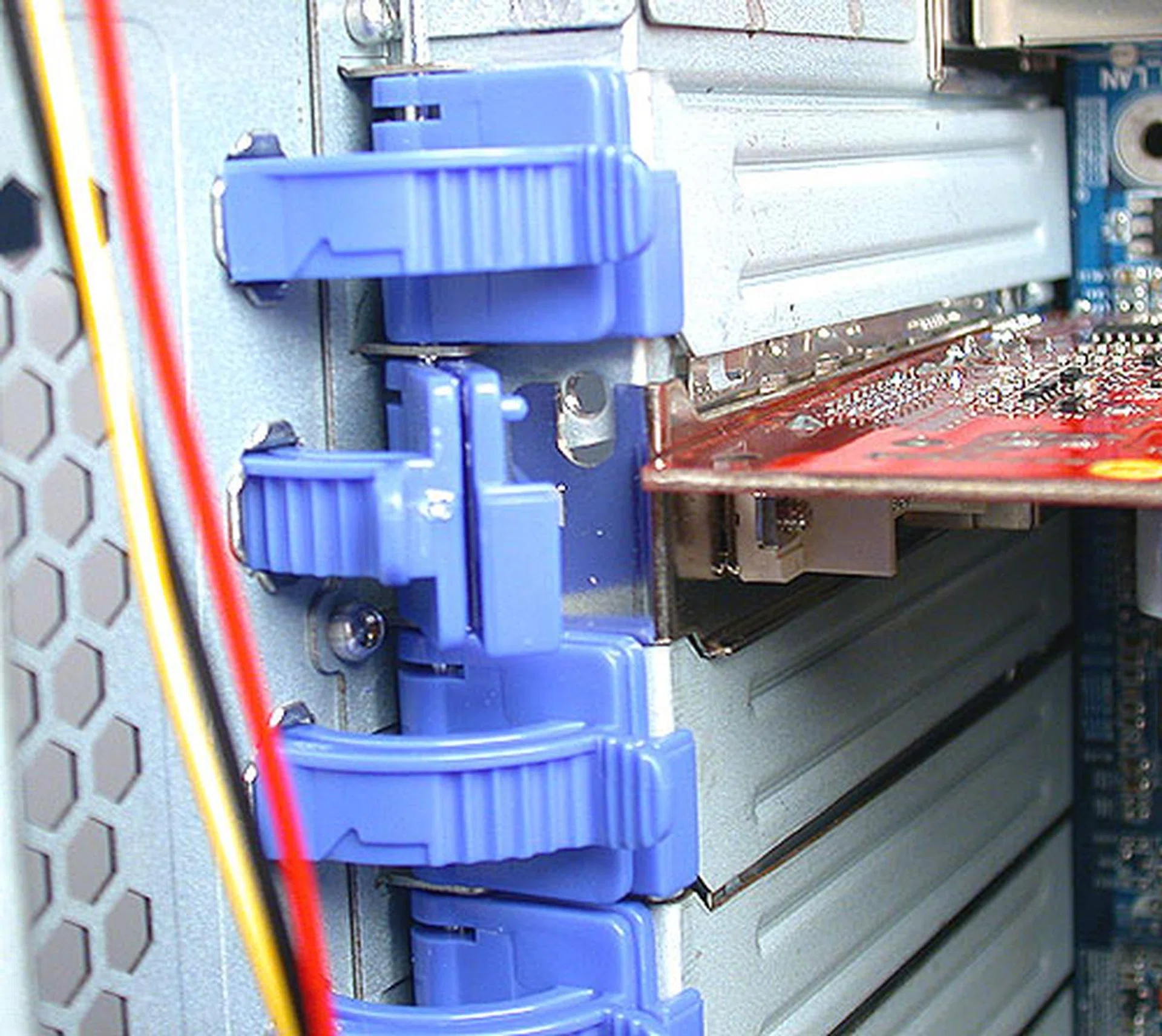 Such plastic locking mechanisms for the expansion slots have been in use for some time now. Despite its plastic origins, we have yet to find one break on us.