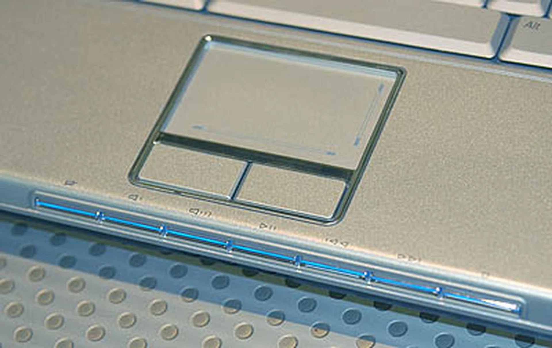 Dedicated music controls are available below the track pad.