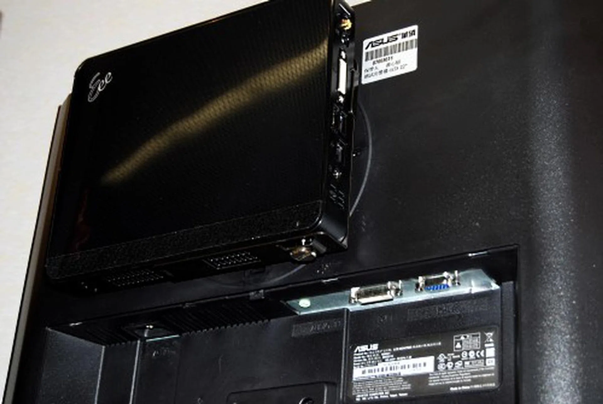  Besides using a stand, there's also the option of mounting the Eee Box on a monitor.  