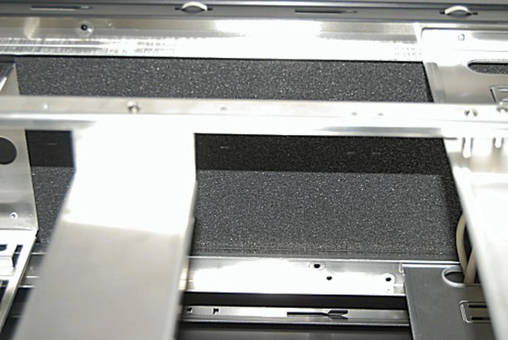 Shown here is the sound dampening material located on the underside of the casing's 'roof'.
