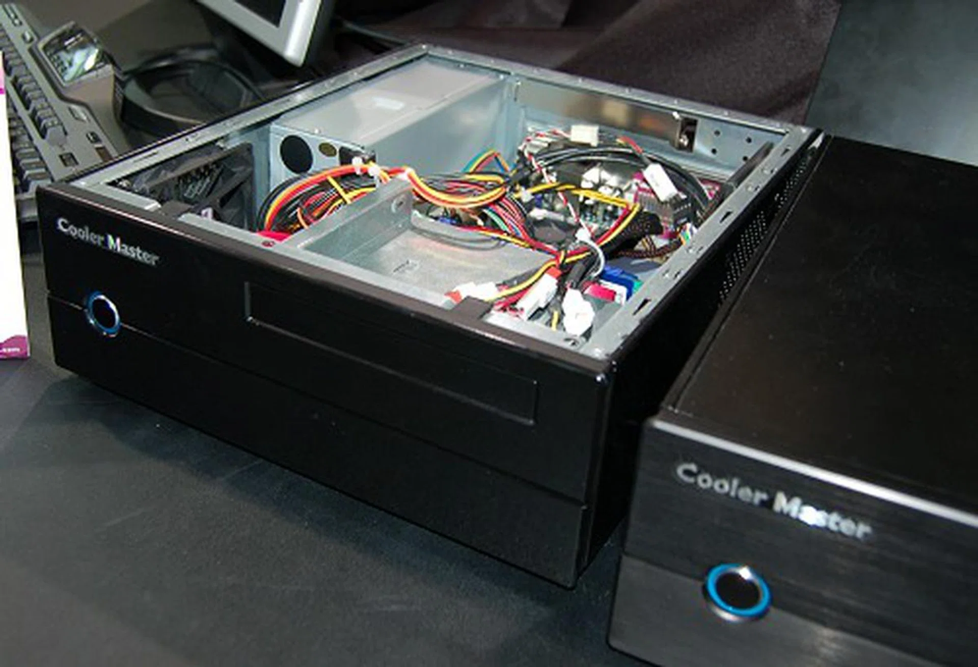  Cooler Master is all ready for the mini revolution with this mini ITX-1 chassis. It has a steel chassis that measures 280 x 95 x 330mm and comes equipped with a TFX power supply of up to 200W. It can house a single slim 5.25-inch optical drive and a single internal 3.5-inch hard drive only. Minimalist in appearance, it is a very petite chassis that should easily tuck away in many places. Tuck in a GeForce 9300 mGPU mini ITX board inside and you're all set for a tiny HTPC system.  
