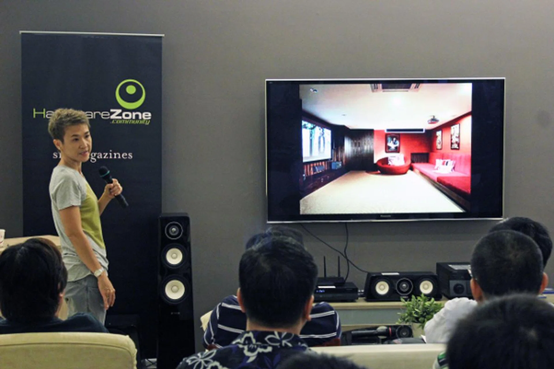 Calsia Lee, sales and marketing director of Mudian, shows the audience one of the many custom projects Mudian has worked on. 