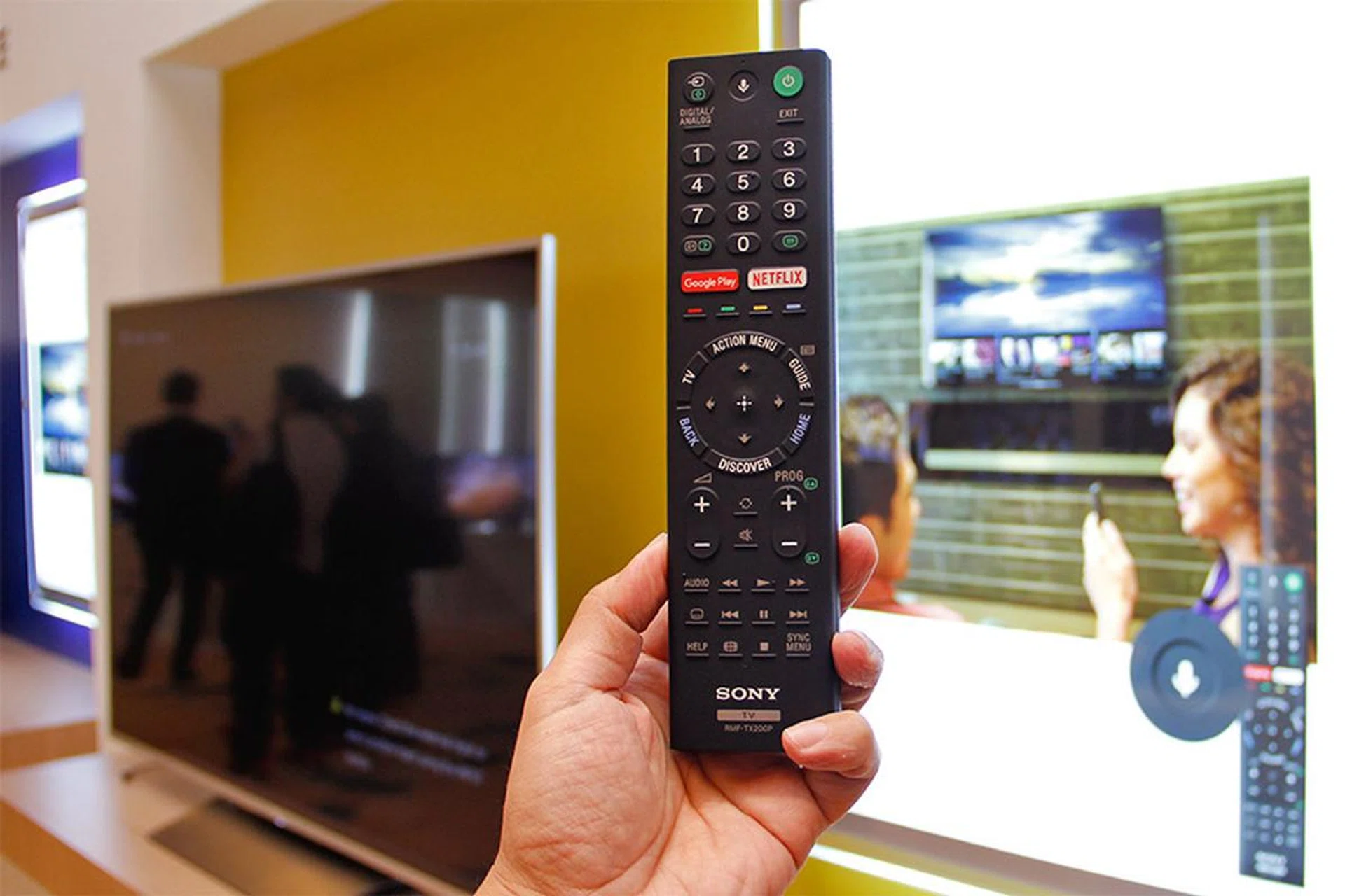 The new remote control has a Voice Search button. And notice the Google Play and Netflix keys.